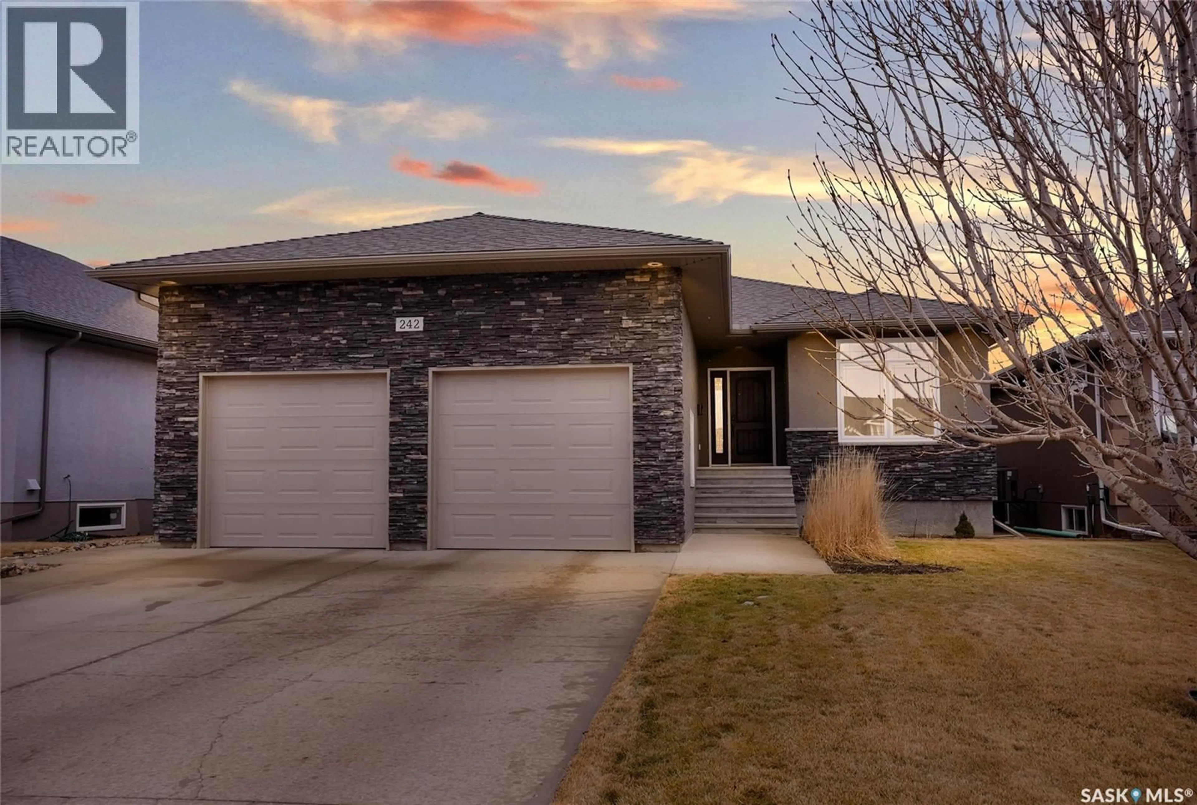Home with brick exterior material, street for 242 WOOD LILY DRIVE, Moose Jaw Saskatchewan S6J0A3