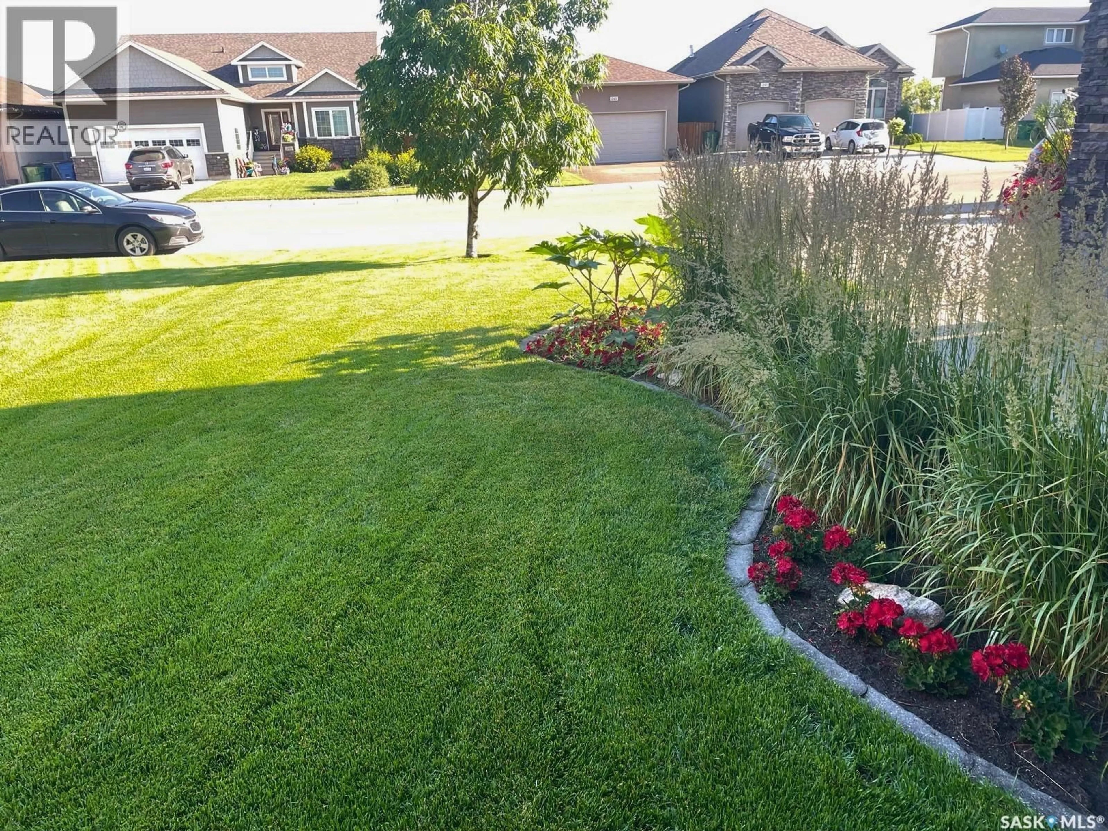 A pic from outside/outdoor area/front of a property/back of a property/a pic from drone, street for 242 WOOD LILY DRIVE, Moose Jaw Saskatchewan S6J0A3