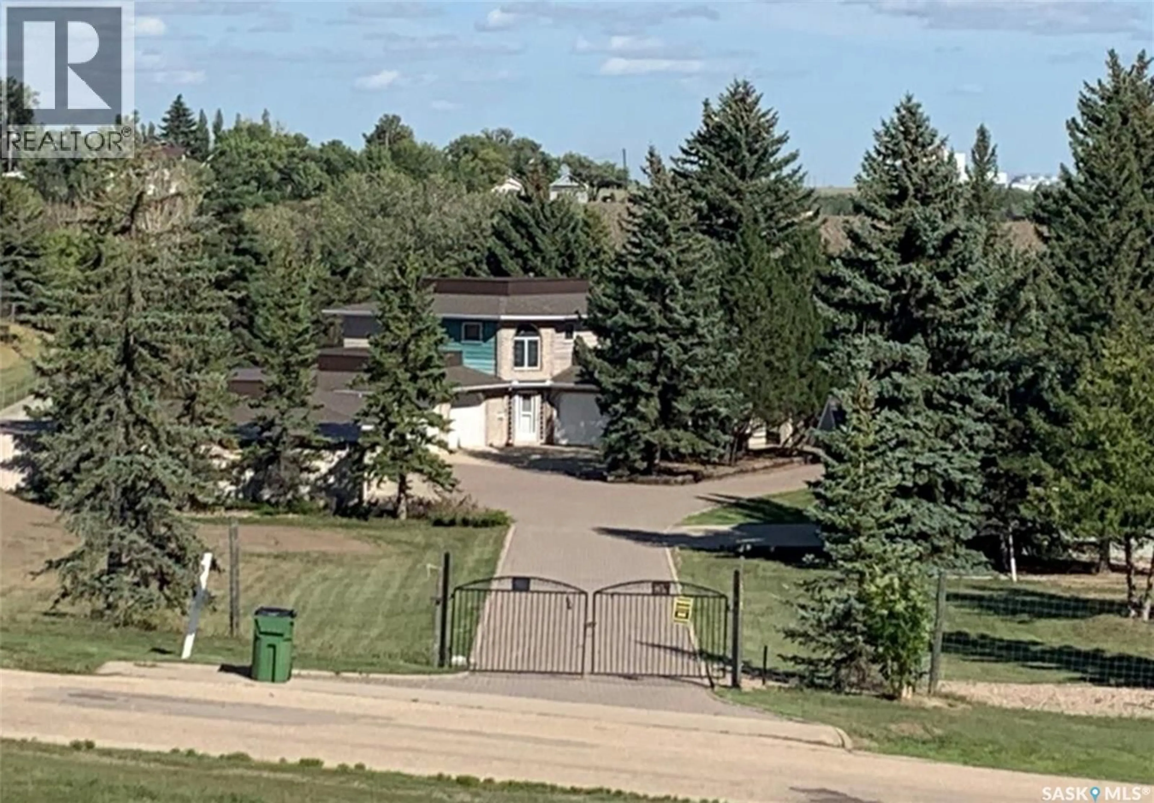 A pic from outside/outdoor area/front of a property/back of a property/a pic from drone, mountain view for 1055 7TH AVENUE, Moose Jaw Saskatchewan S6H5R2
