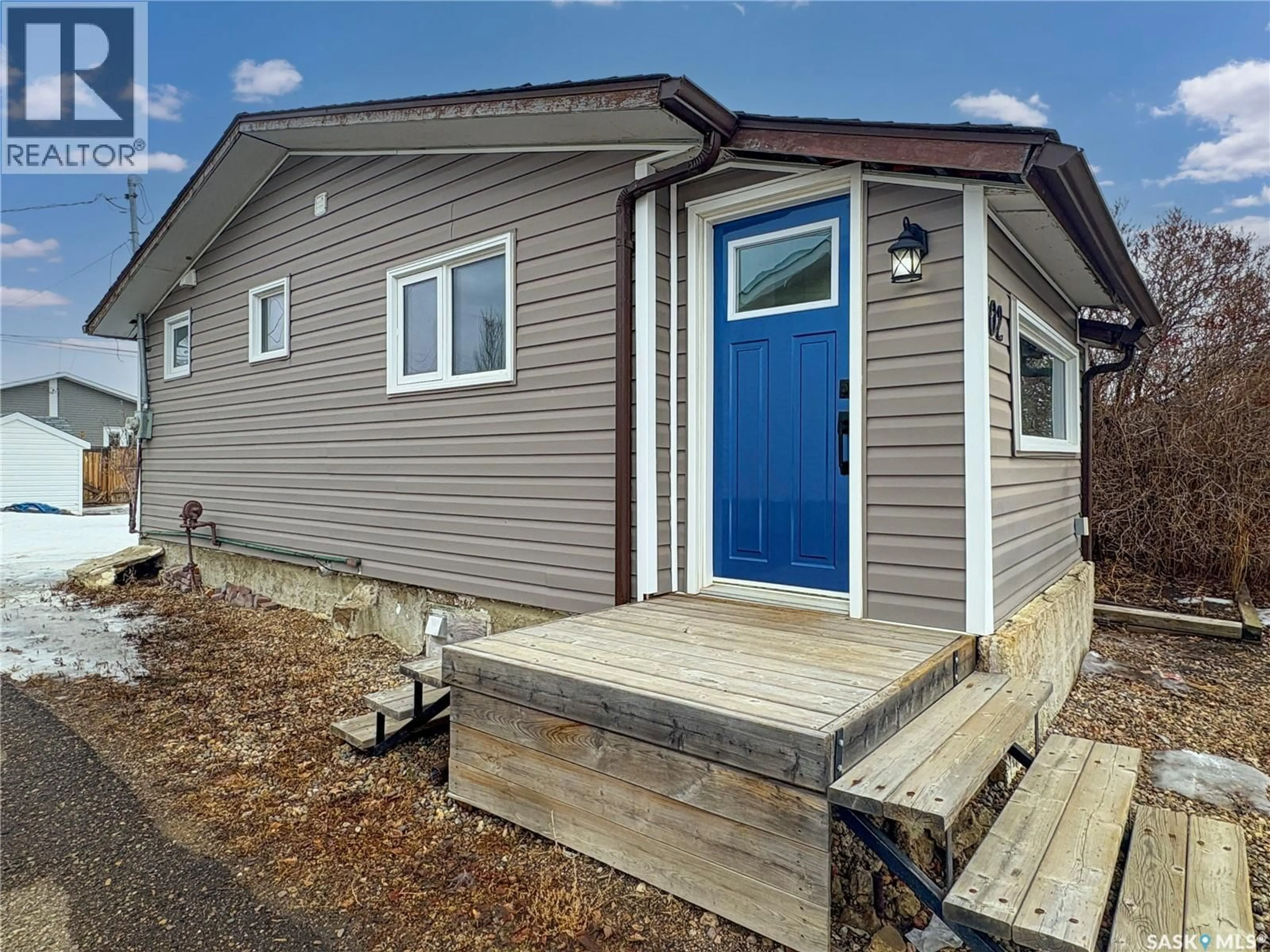Home with vinyl exterior material, street for 102 18TH STREET, Battleford Saskatchewan S0M0E0