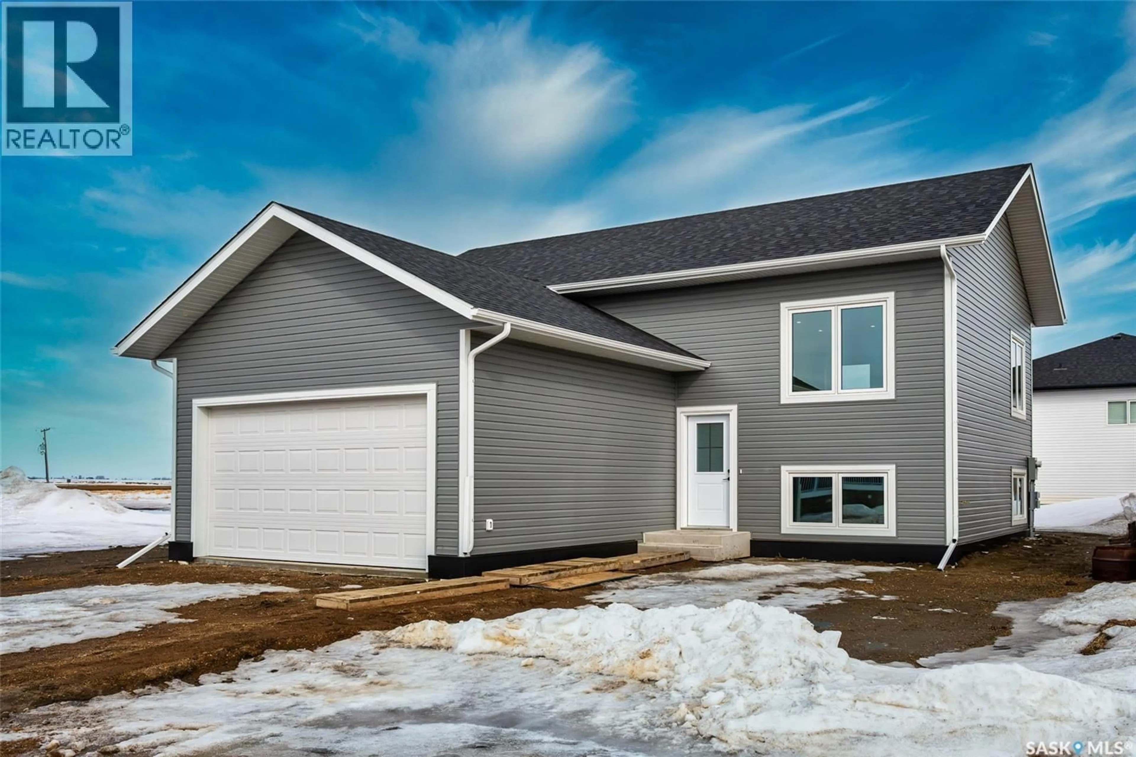 Home with vinyl exterior material, street for 129 MCDONALD STREET, Aberdeen Saskatchewan S0K0A0