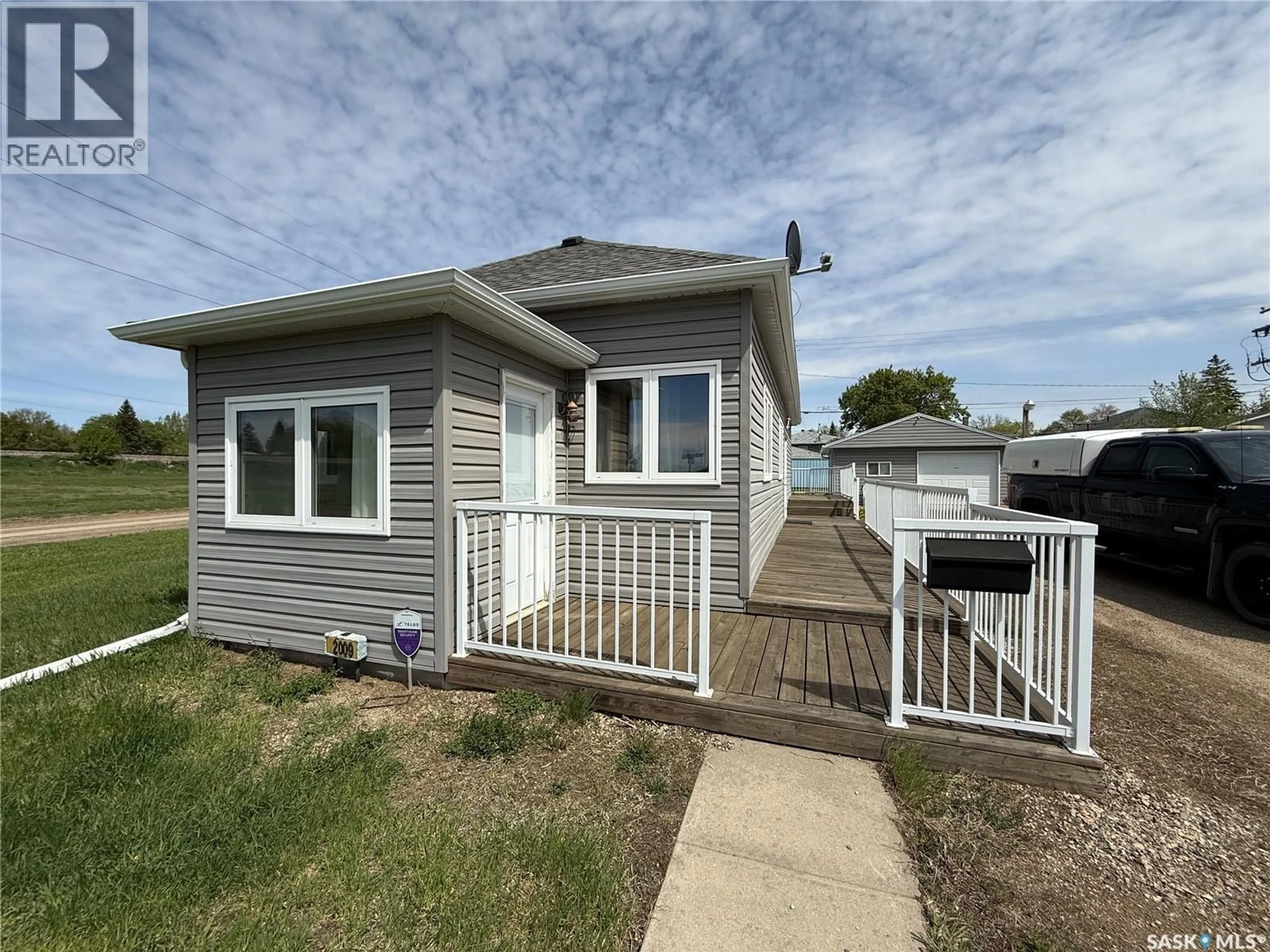 Home with vinyl exterior material, street for 2009 CONNAUGHT STREET, Regina Saskatchewan S4T4T8