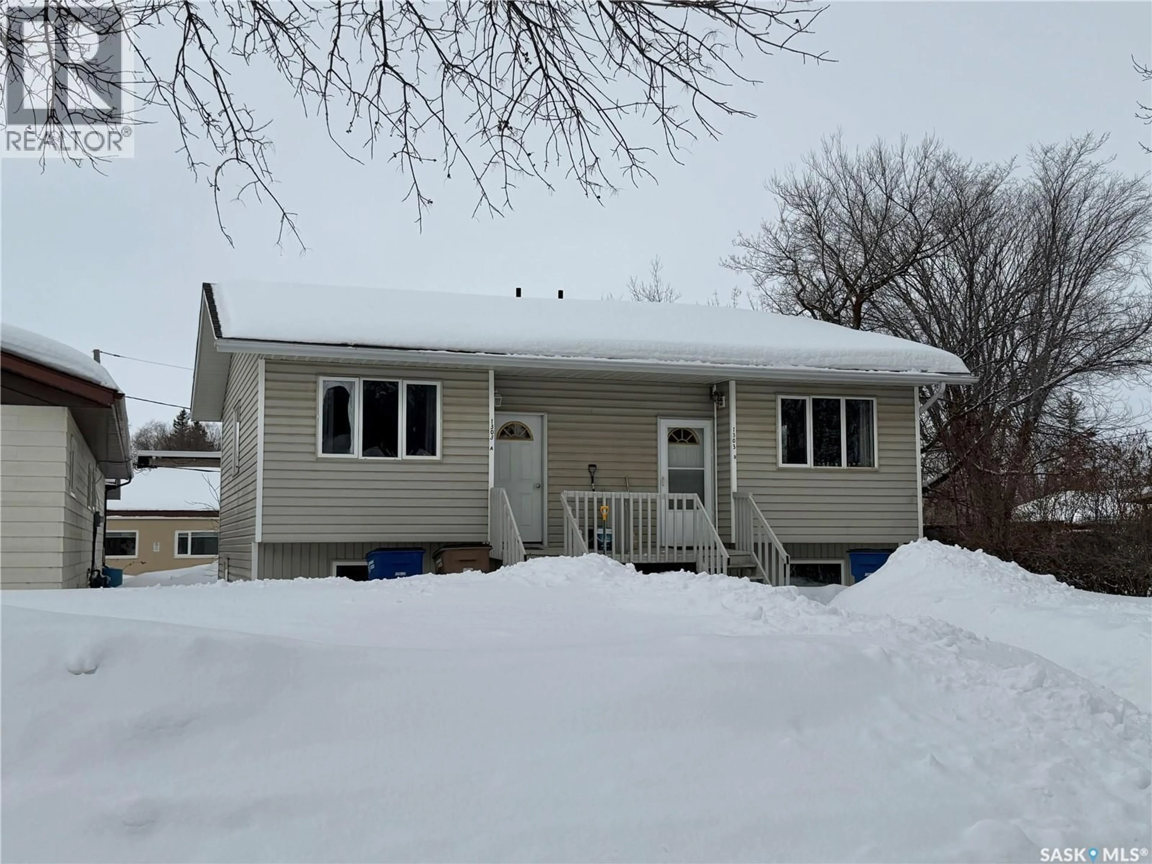 Home with vinyl exterior material, street for 1303 99TH STREET, Tisdale Saskatchewan S0E1T0