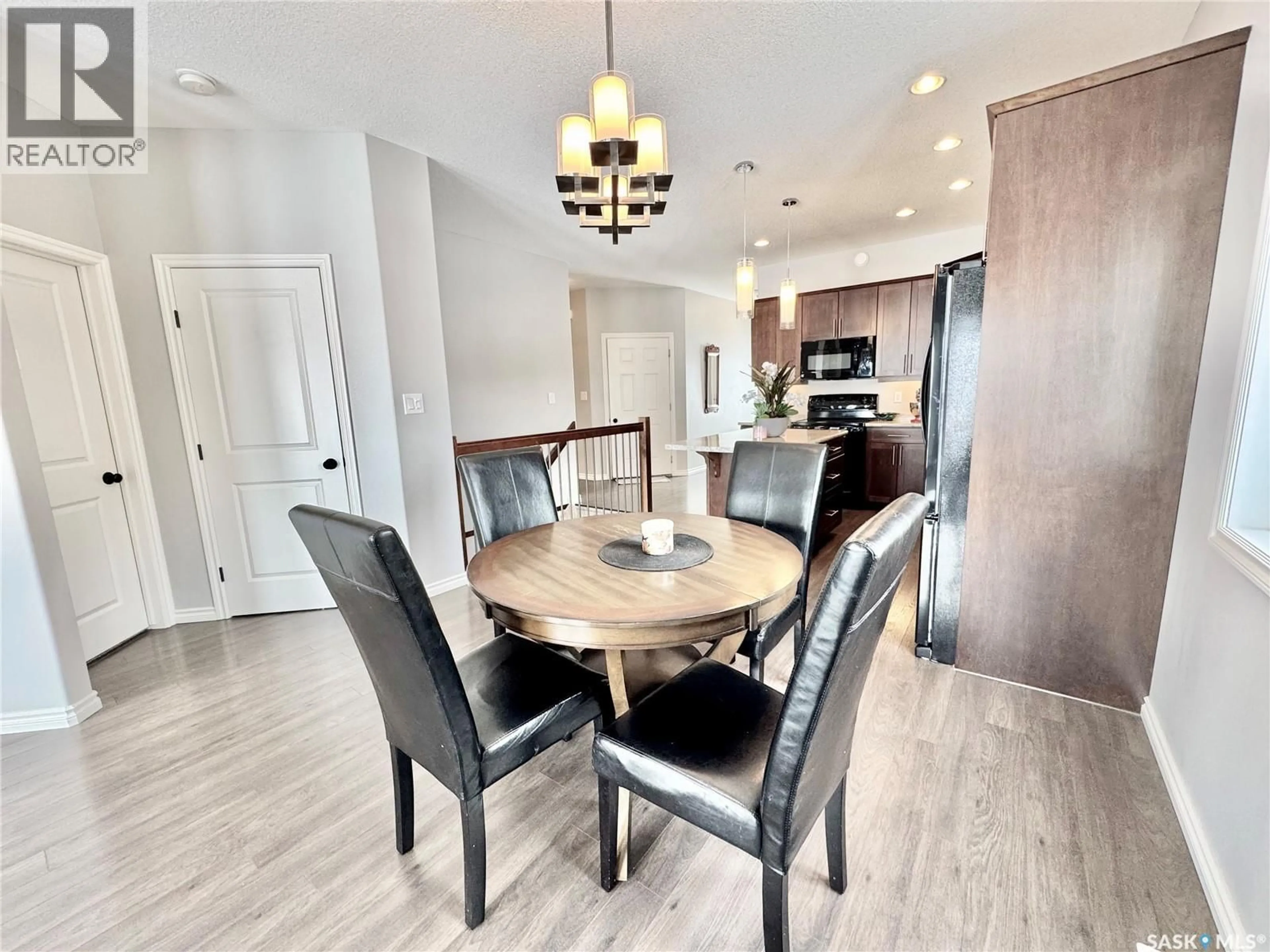 Dining room, wood/laminate floor for 9 - 550 SOUTHWOOD DRIVE, Prince Albert Saskatchewan S6V4T9
