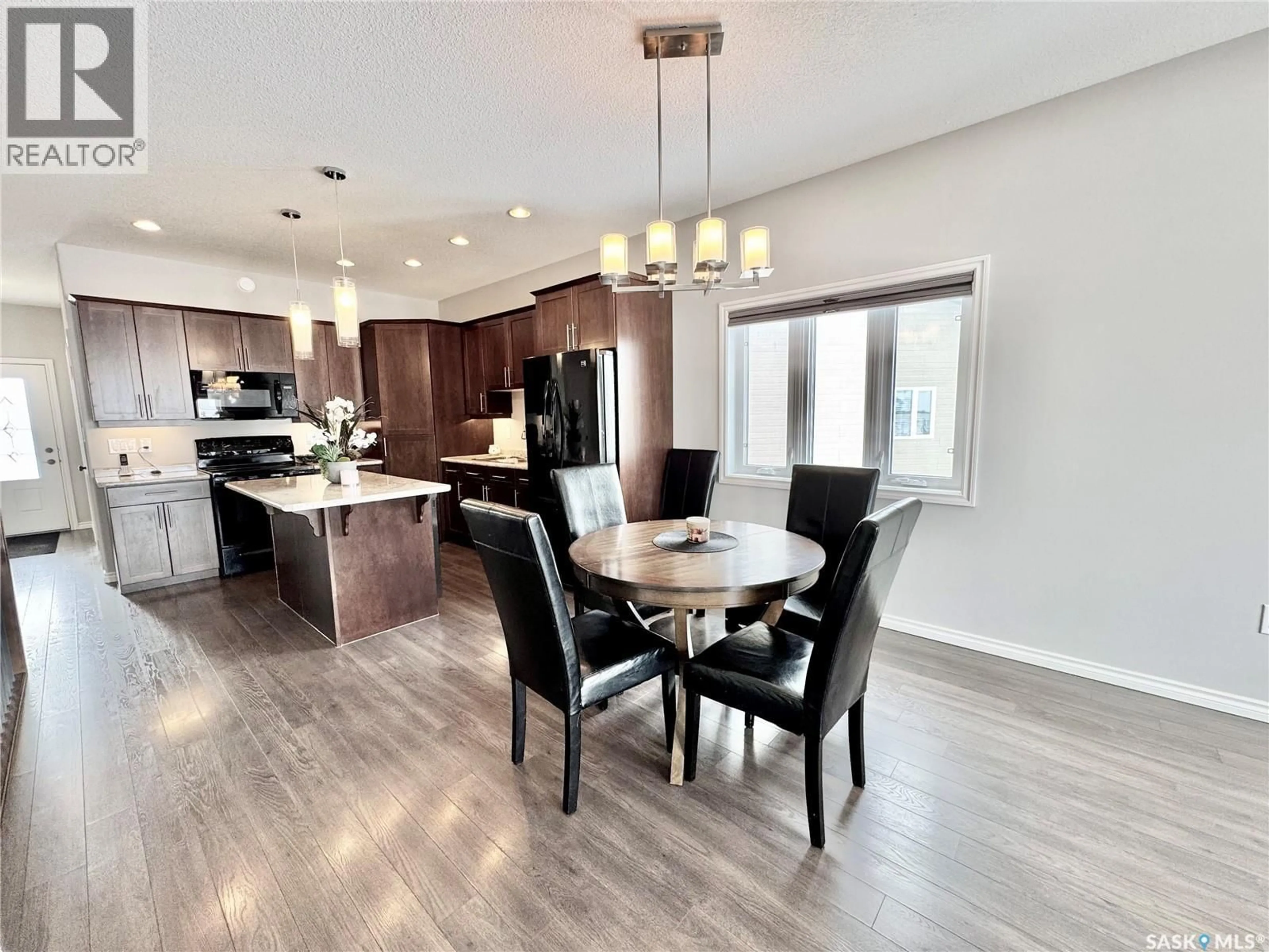 Open concept kitchen, wood/laminate floor for 9 - 550 SOUTHWOOD DRIVE, Prince Albert Saskatchewan S6V4T9