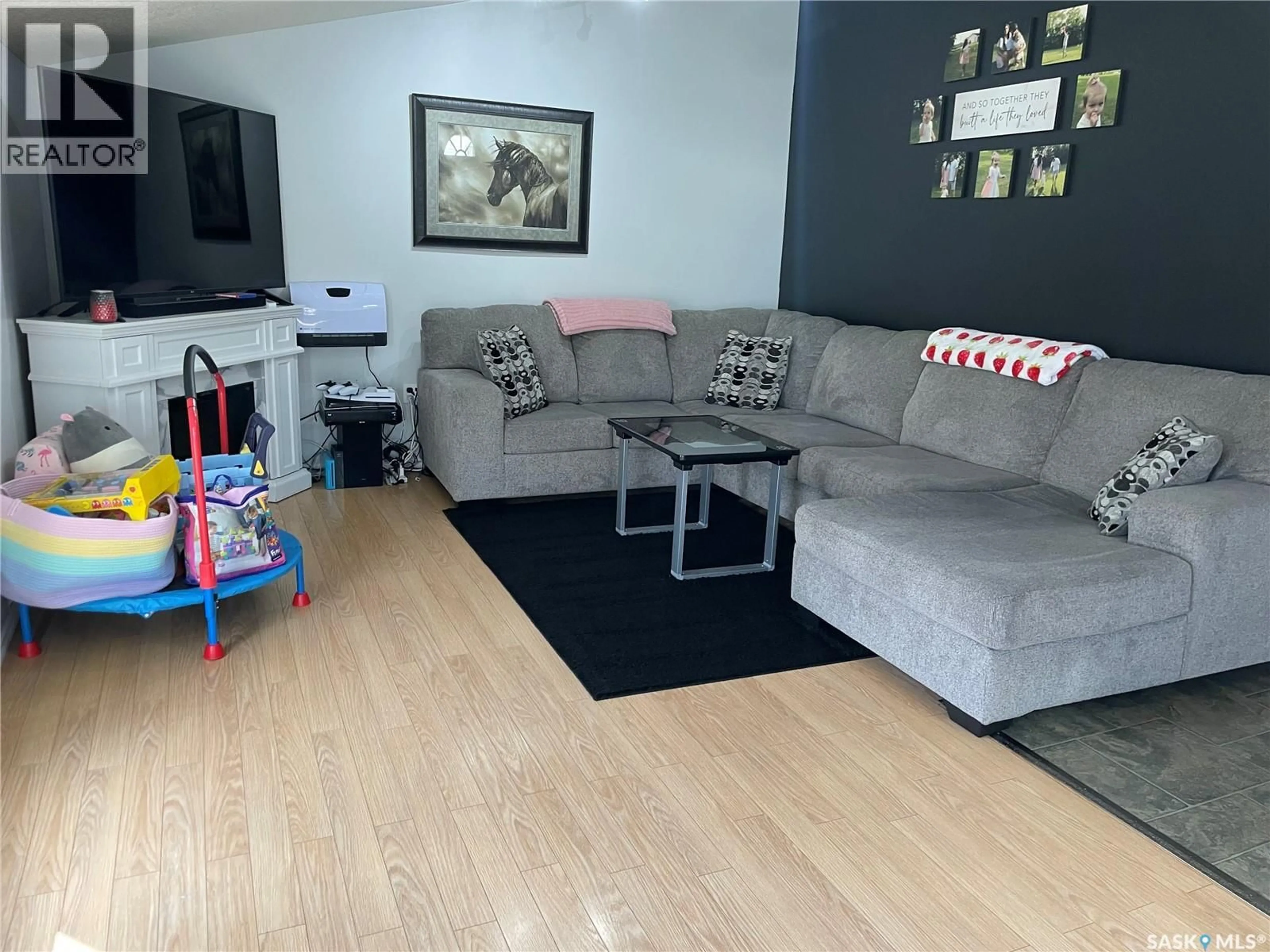 Living room with furniture, unknown for 1002 2ND STREET, Estevan Saskatchewan S4A0L7