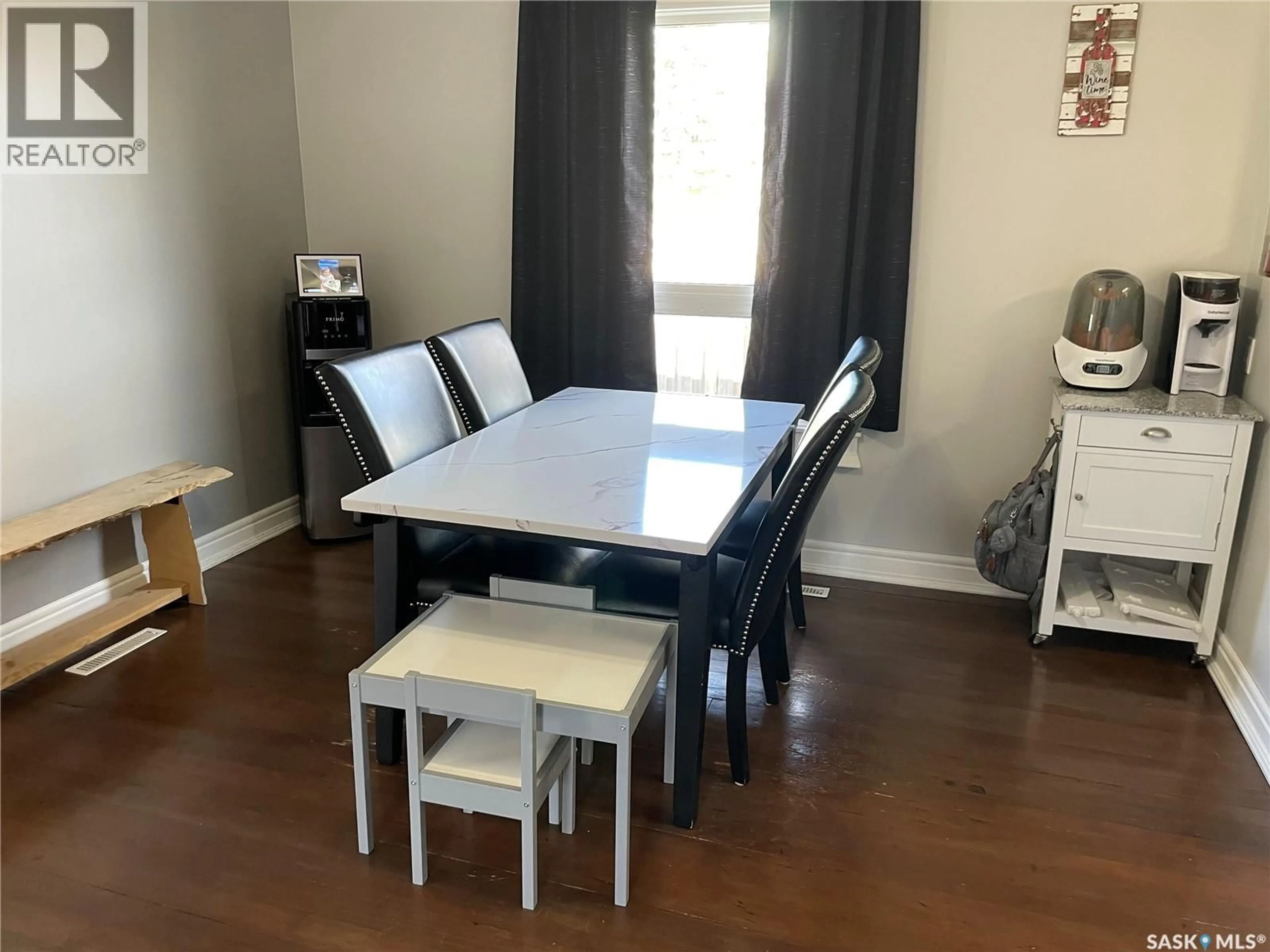 Dining room, wood/laminate floor for 1002 2ND STREET, Estevan Saskatchewan S4A0L7