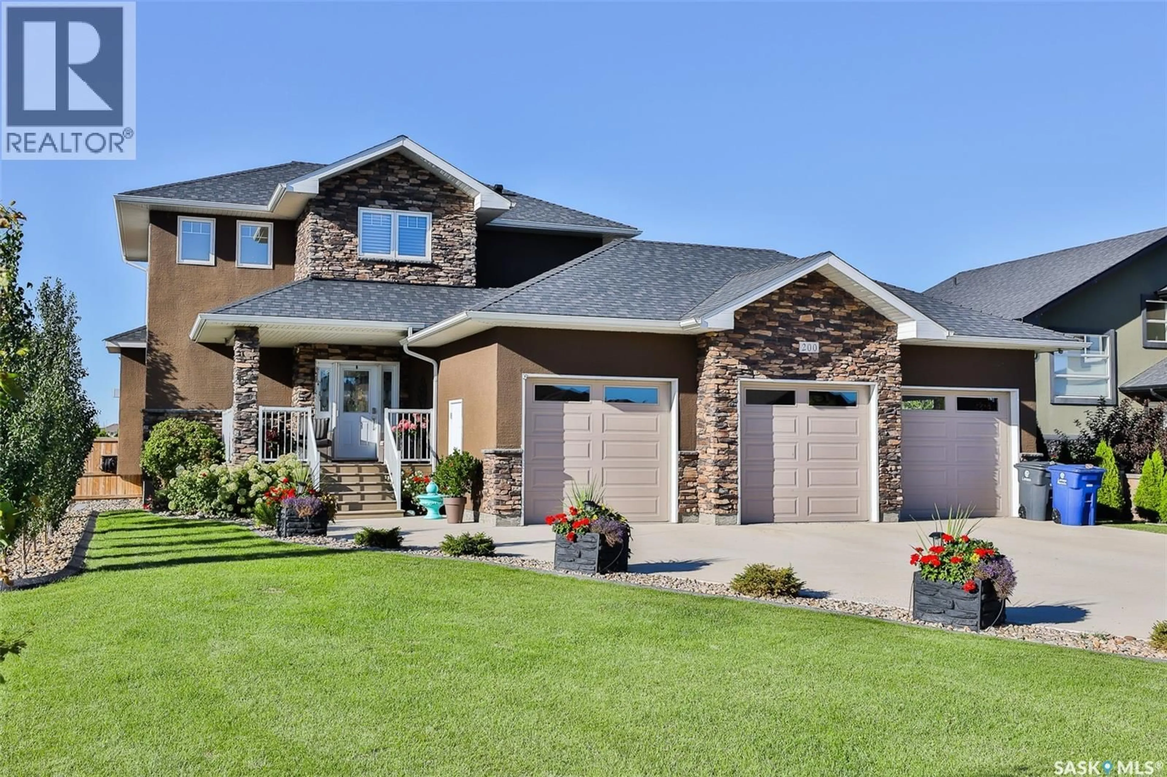 Home with brick exterior material, street for E - 200 CLUBHOUSE BOULEVARD, Warman Saskatchewan S0K4S1