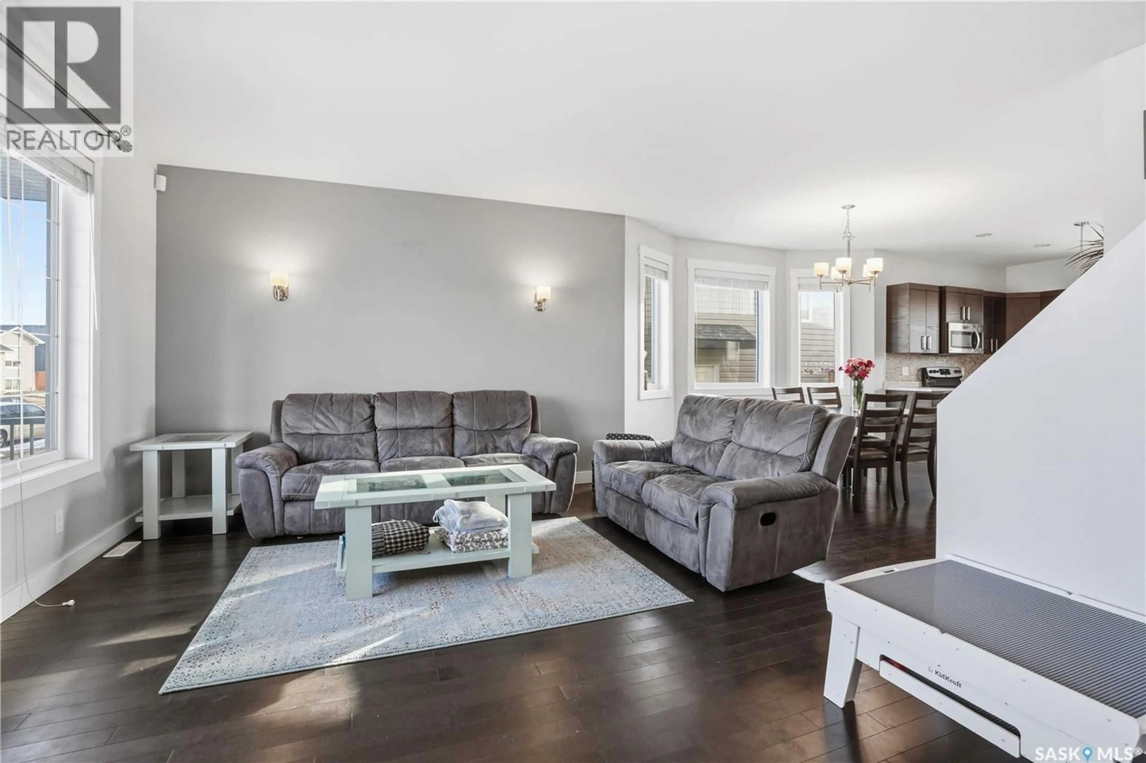 Living room with furniture, wood/laminate floor for 338 ROSEWOOD BOULEVARD, Saskatoon Saskatchewan S7V0G9