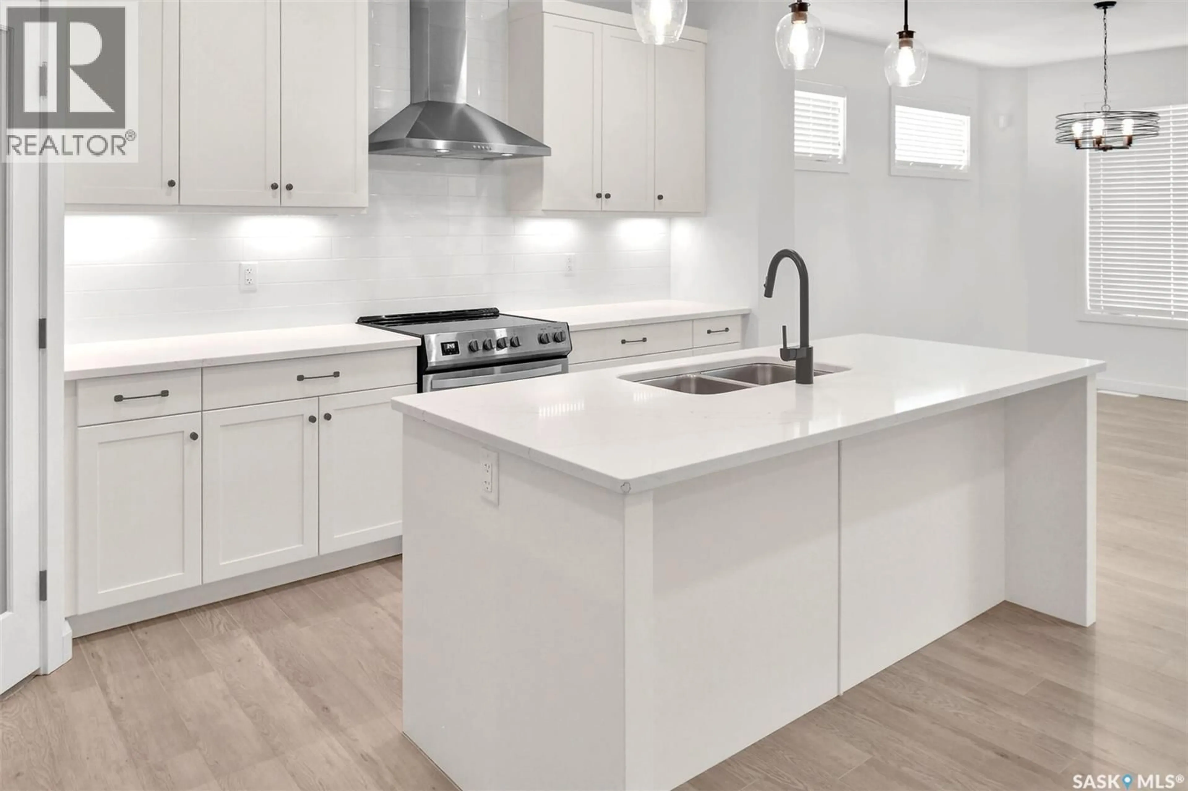 Open concept kitchen, ceramic/tile floor for 104 FORSEY AVENUE, Saskatoon Saskatchewan S7W1C8