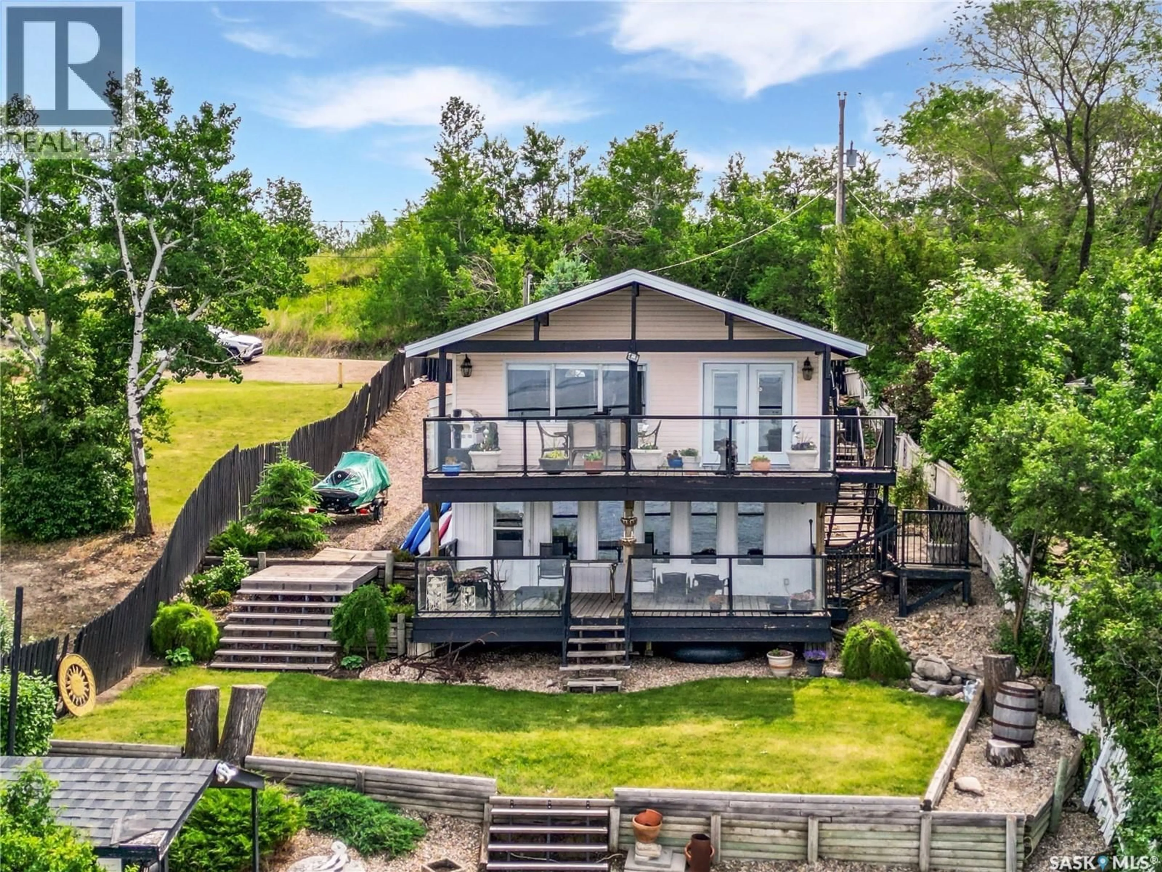 A pic from outside/outdoor area/front of a property/back of a property/a pic from drone, water/lake/river/ocean view for 34 JACKFISH LAKE CRESCENT, Meota Rm No.468 Saskatchewan S0M0L0