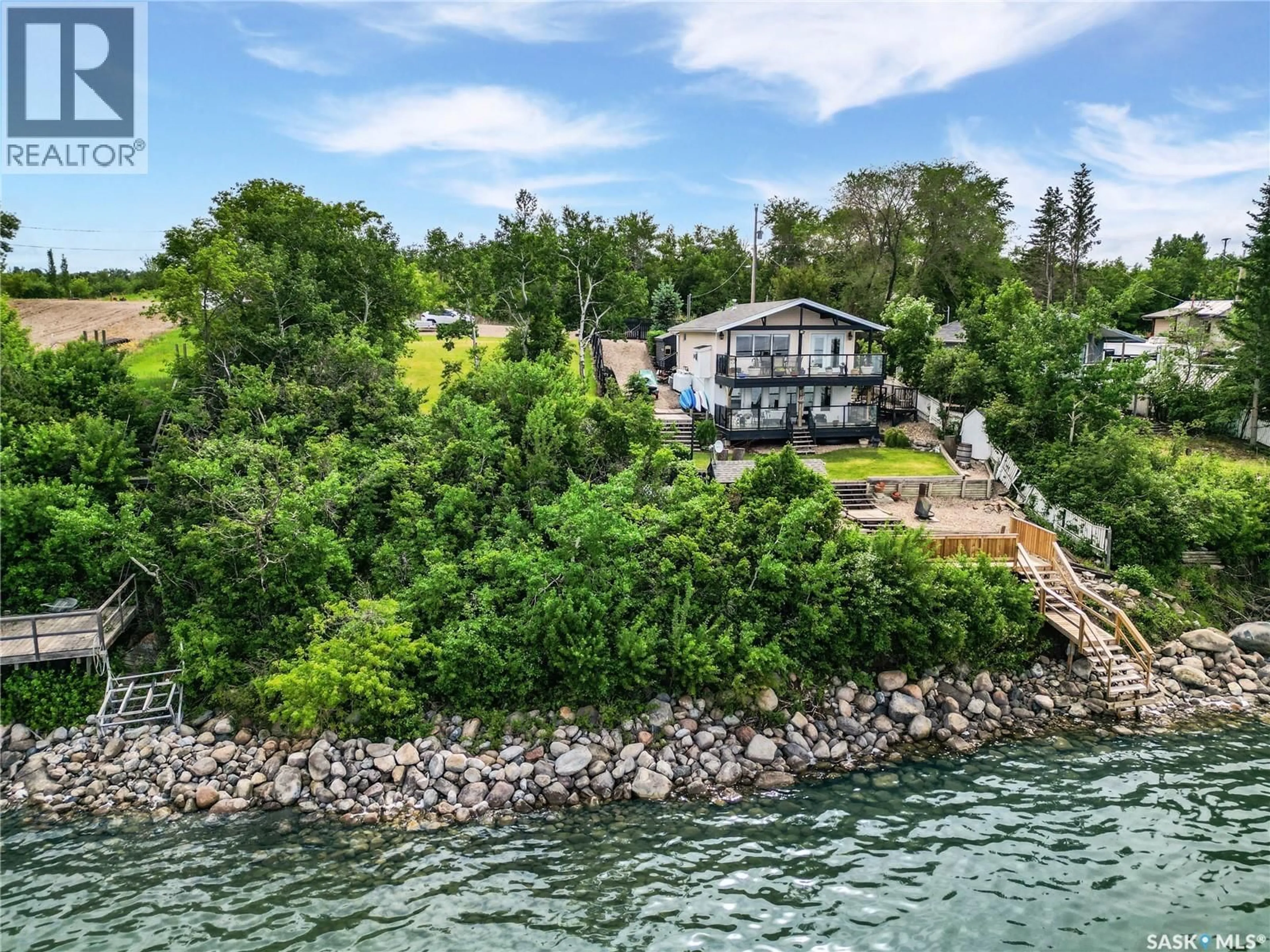 A pic from outside/outdoor area/front of a property/back of a property/a pic from drone, water/lake/river/ocean view for 34 JACKFISH LAKE CRESCENT, Meota Rm No.468 Saskatchewan S0M0L0