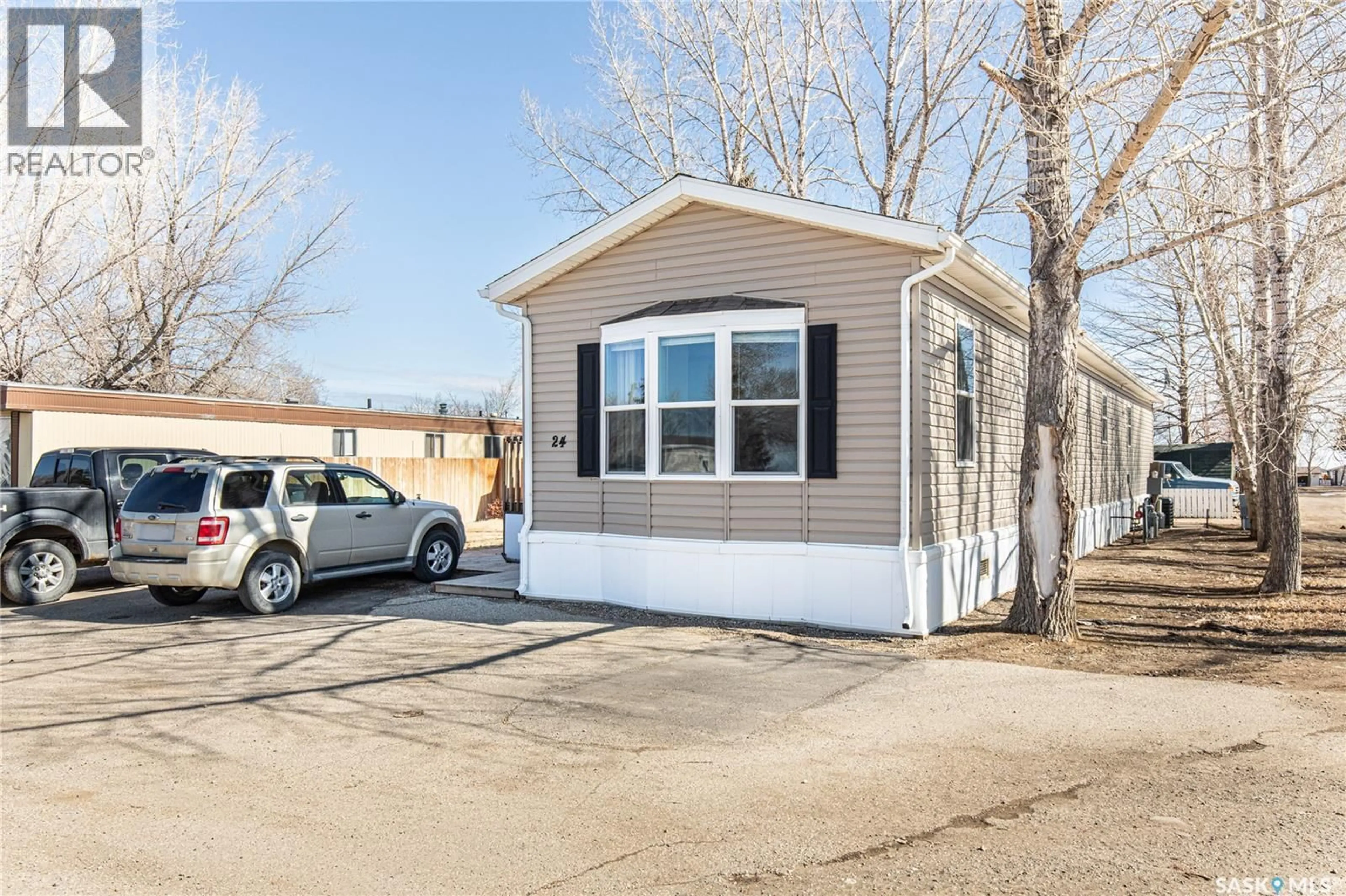 Home with vinyl exterior material, street for A24 - 1455 9TH AVENUE, Moose Jaw Saskatchewan S6J1C6