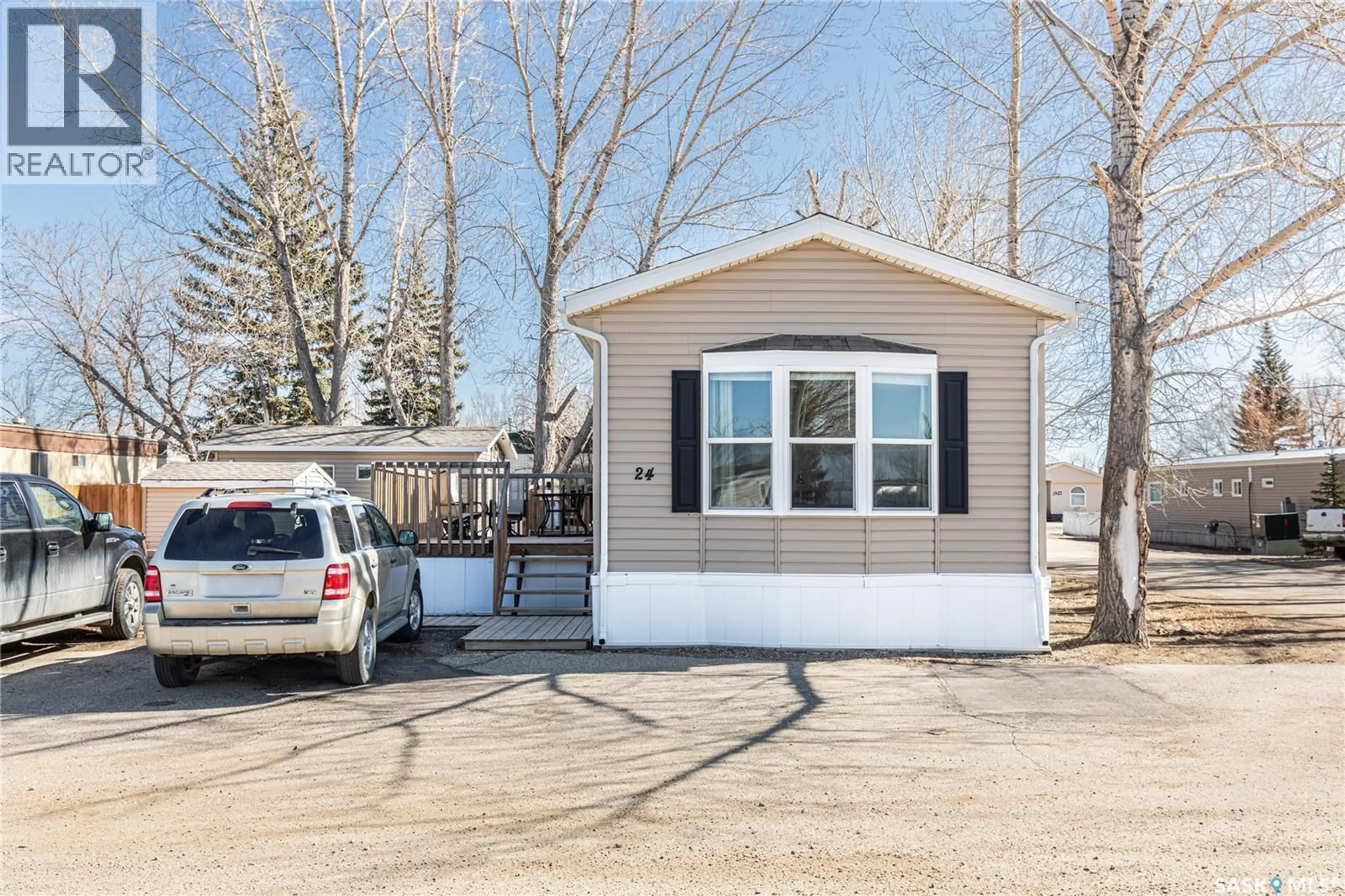 Home with vinyl exterior material, street for A24 - 1455 9TH AVENUE, Moose Jaw Saskatchewan S6J1C6