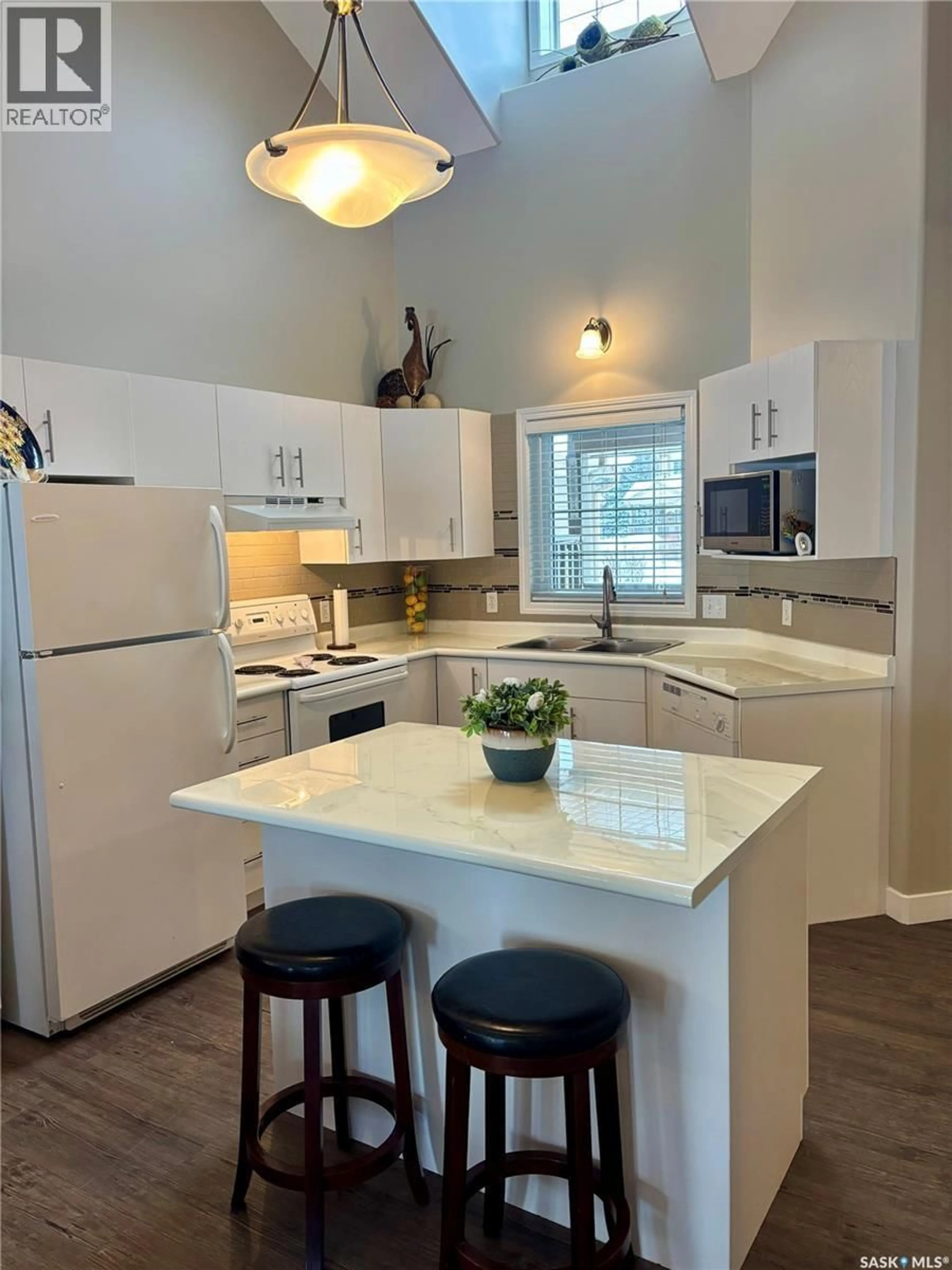 Open concept kitchen, ceramic/tile floor for 66 EAGLE VIEW WAY, Elk Ridge Saskatchewan S0J2Y0