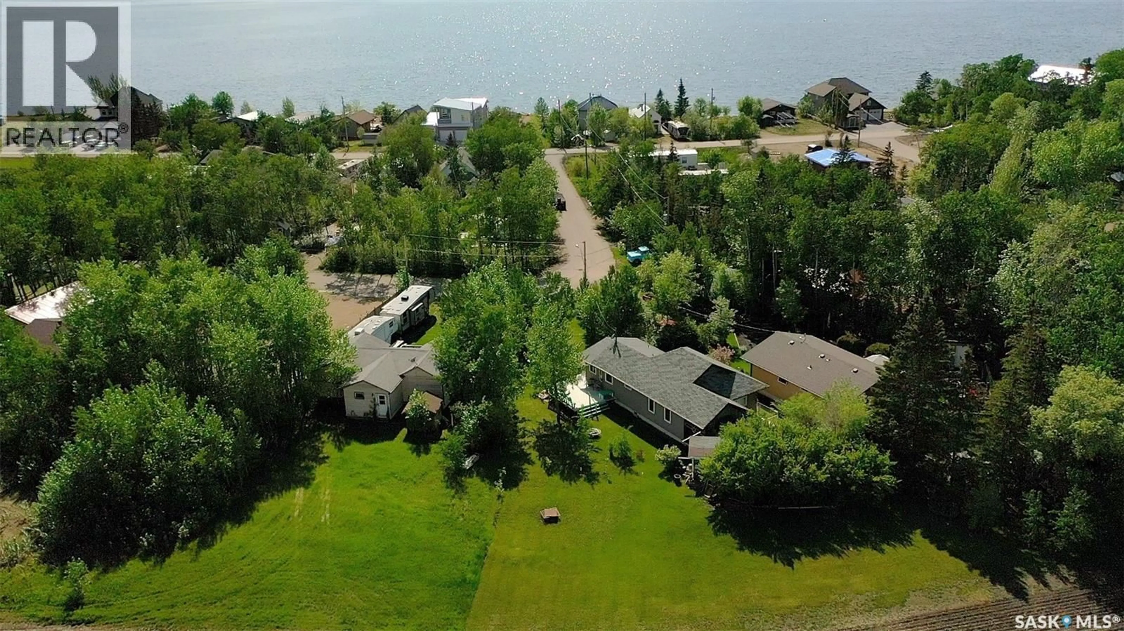 A pic from outside/outdoor area/front of a property/back of a property/a pic from drone, water/lake/river/ocean view for 15 KIM DAWN CRESCENT, Fishing Lake Saskatchewan S0A1Y0
