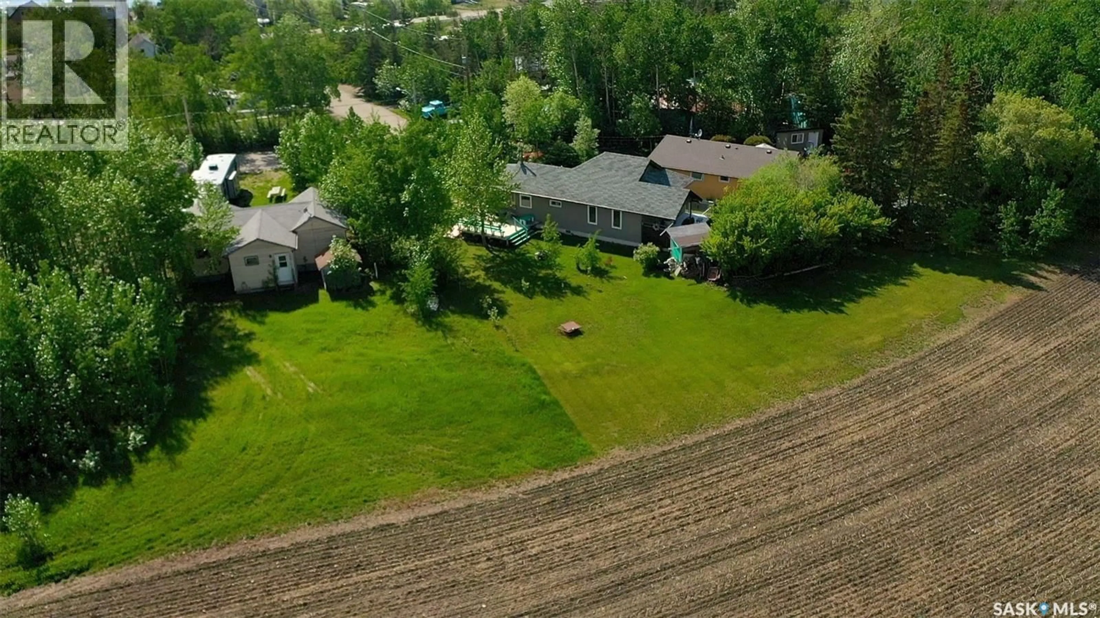 A pic from outside/outdoor area/front of a property/back of a property/a pic from drone, unknown for 15 KIM DAWN CRESCENT, Fishing Lake Saskatchewan S0A1Y0