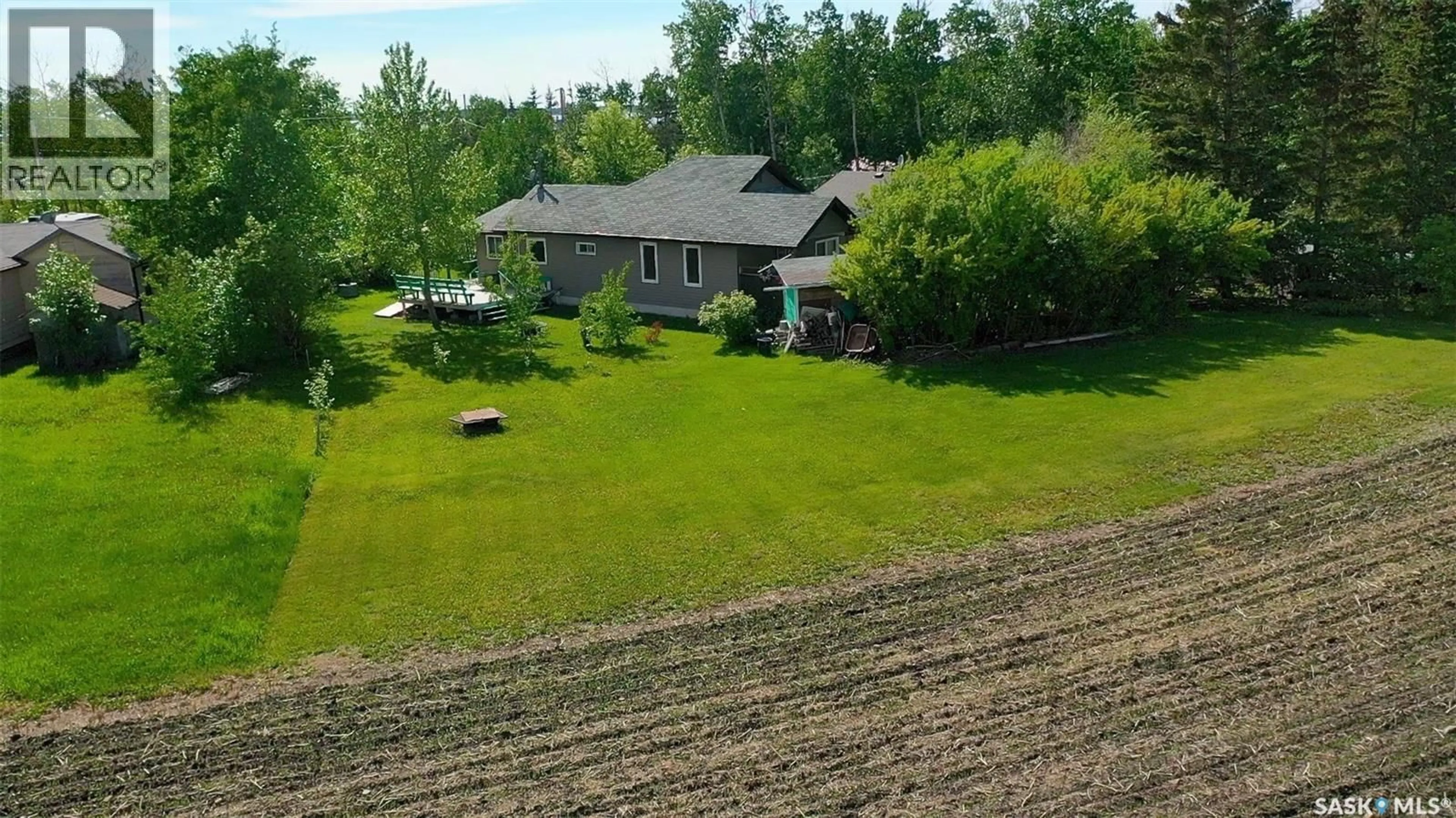 A pic from outside/outdoor area/front of a property/back of a property/a pic from drone, unknown for 15 KIM DAWN CRESCENT, Fishing Lake Saskatchewan S0A1Y0