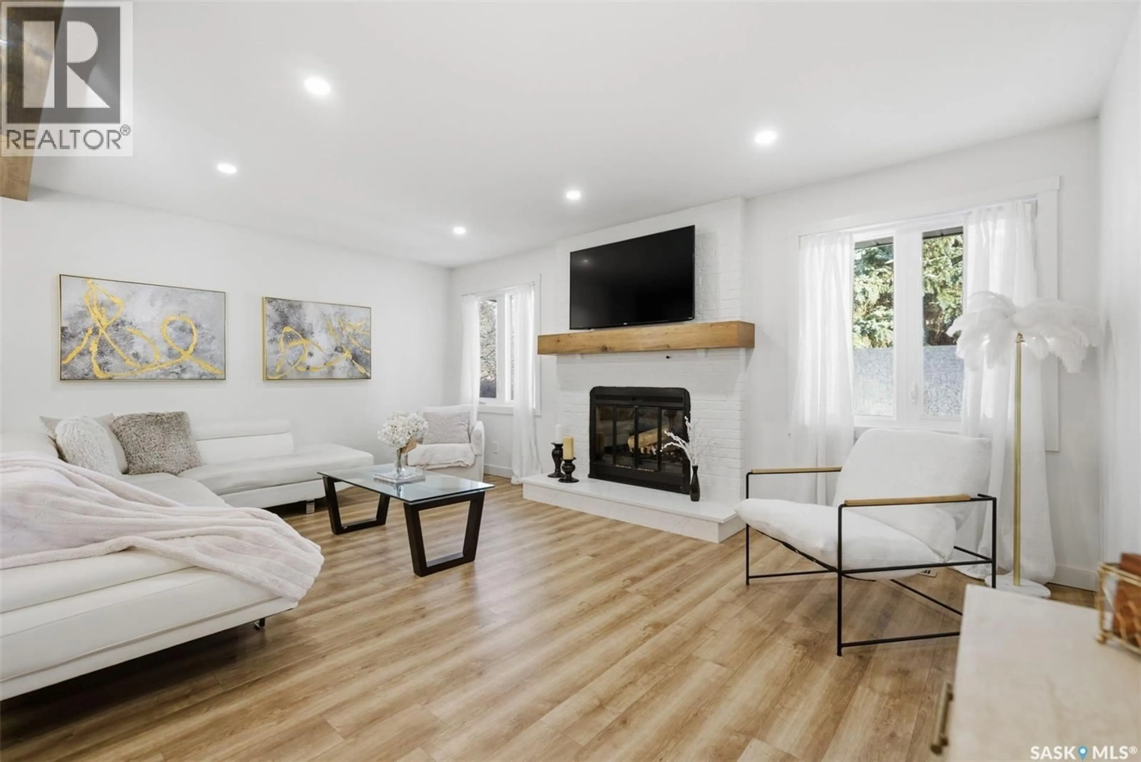 Living room with furniture, wood/laminate floor for 7 KINDRACHUK CRESCENT, Saskatoon Saskatchewan S7K6P9