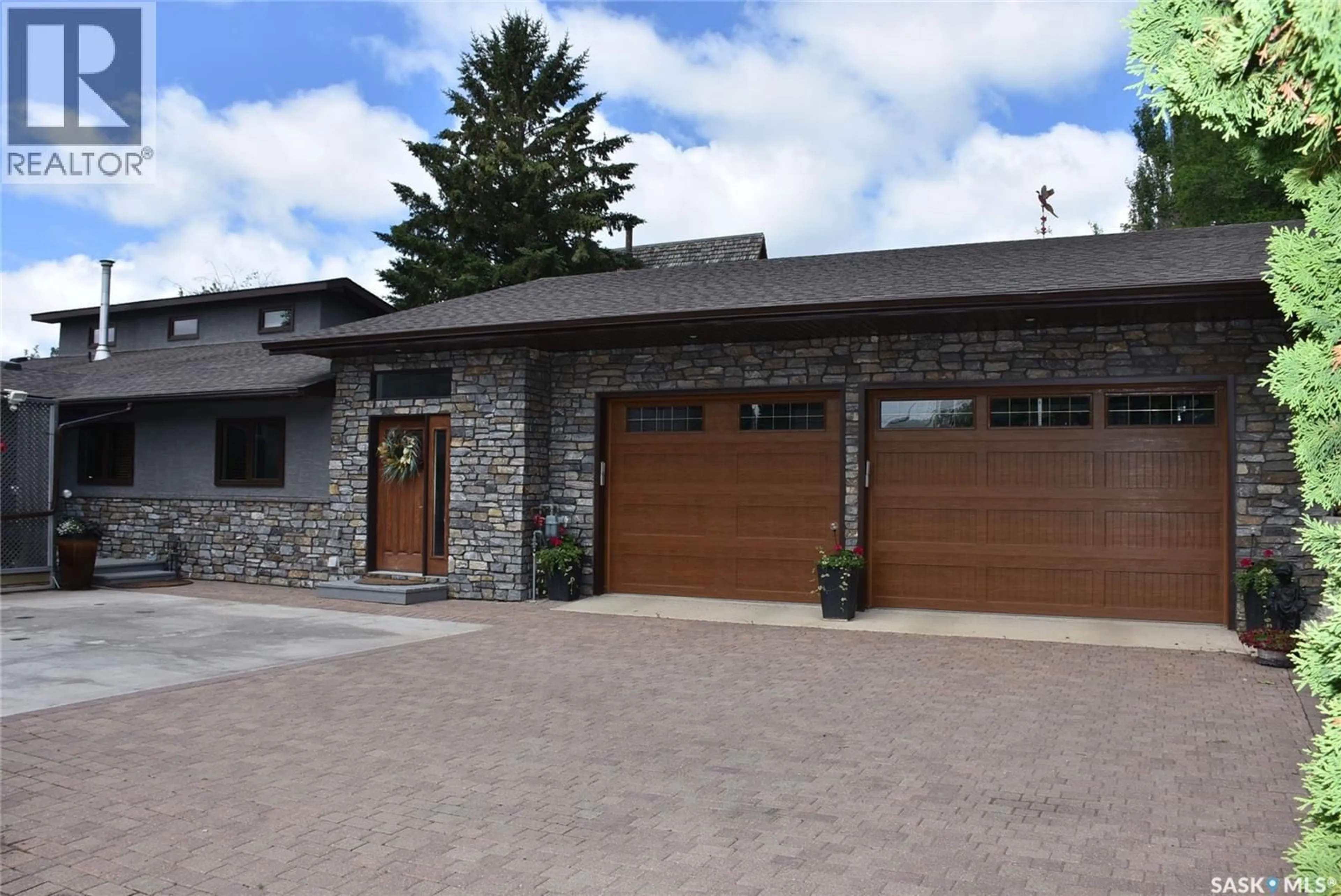 Home with brick exterior material, street for 52 PASQUA LAKE ROAD, North Qu'Appelle Rm No. 187 Saskatchewan S0G1S0