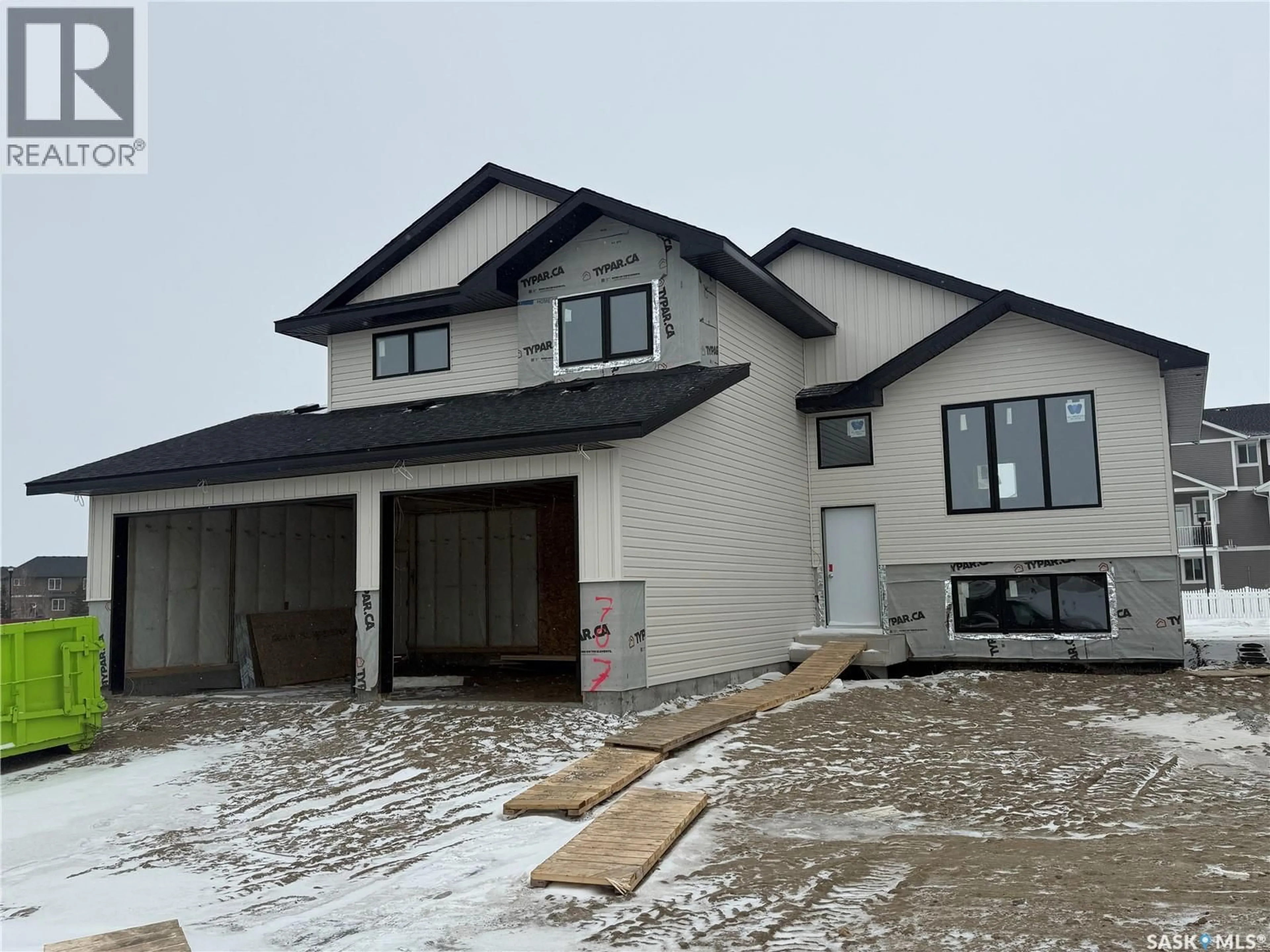 Home with vinyl exterior material, street for 707 BALLESTEROS CRESCENT, Warman Saskatchewan S0K4S3
