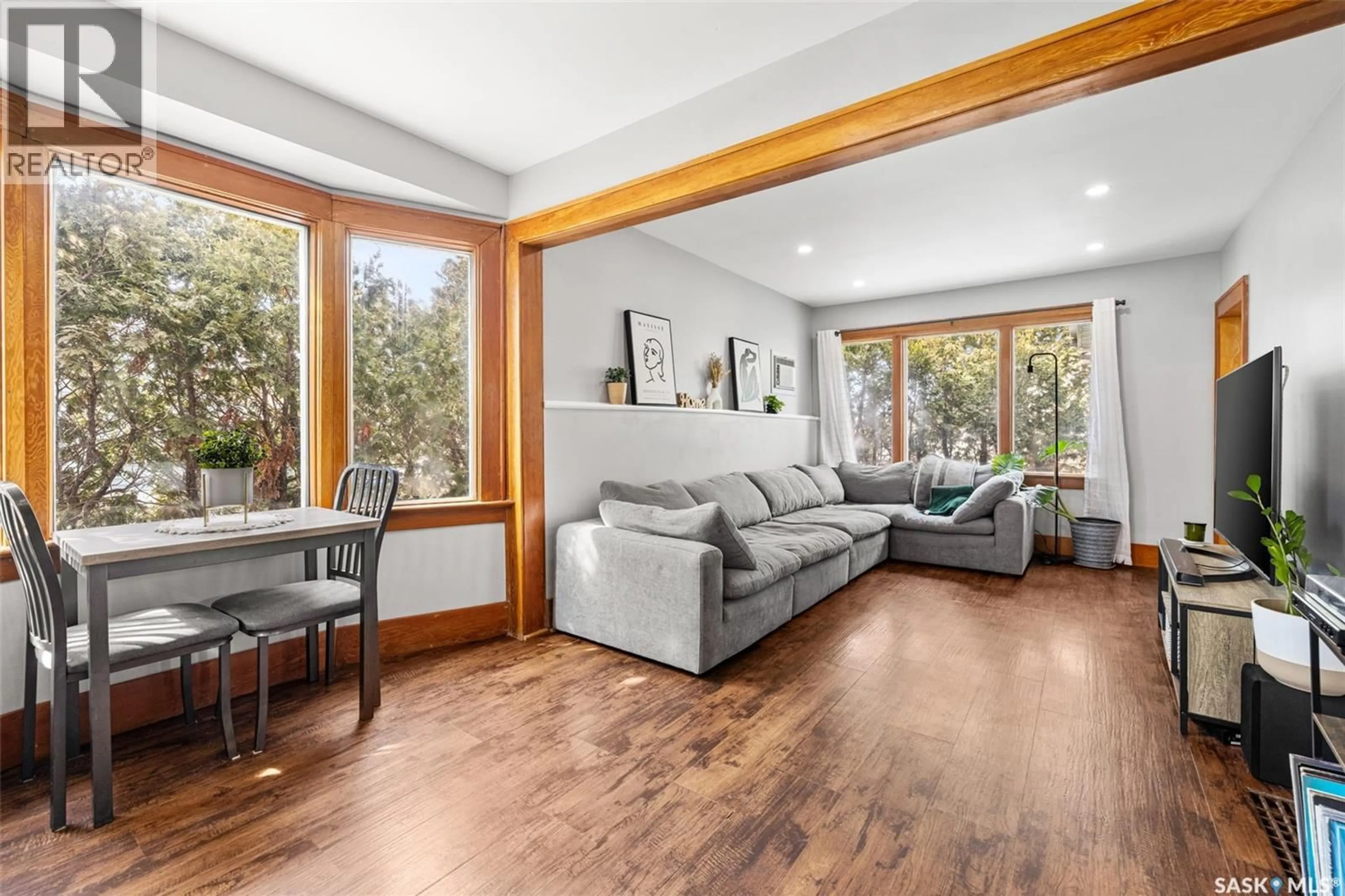 Living room with furniture, wood/laminate floor for 3637 VICTORIA AVENUE, Regina Saskatchewan S4T1M4