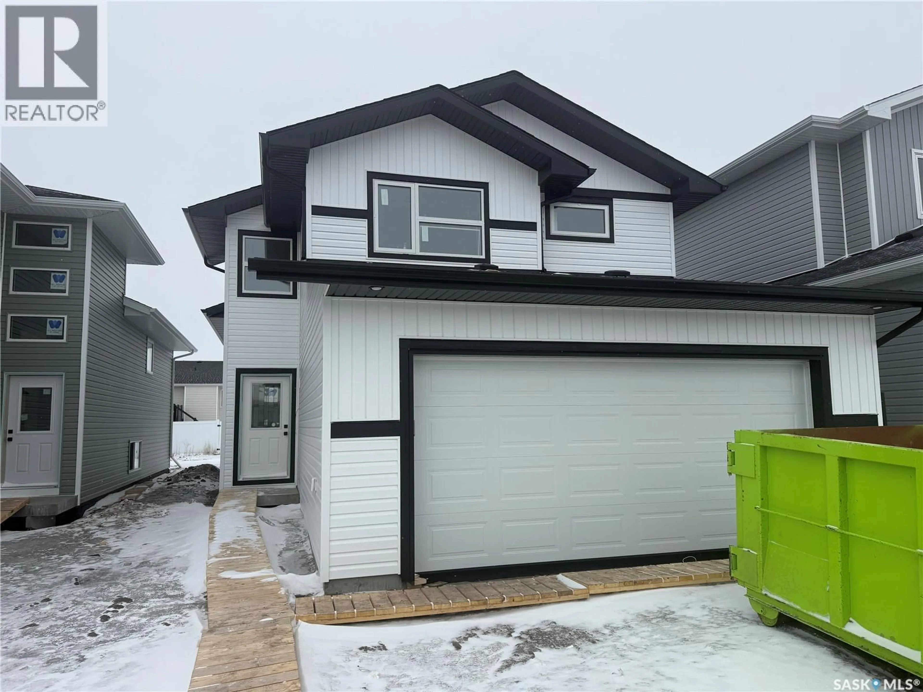Home with vinyl exterior material, street for 237 FROESE CRESCENT, Warman Saskatchewan S0K4S0