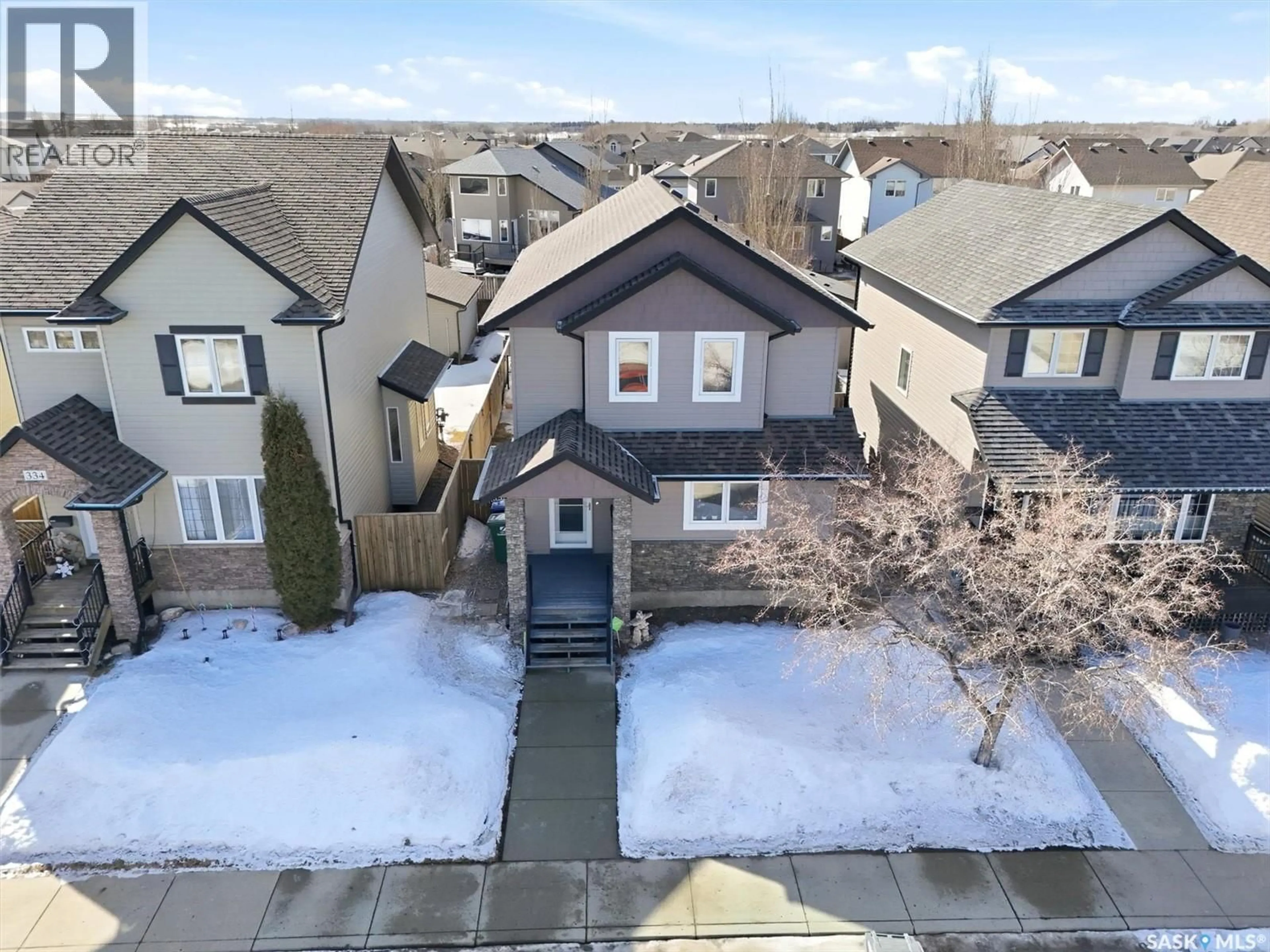 A pic from outside/outdoor area/front of a property/back of a property/a pic from drone, street for 330 LYND LANE, Saskatoon Saskatchewan S7T0B1