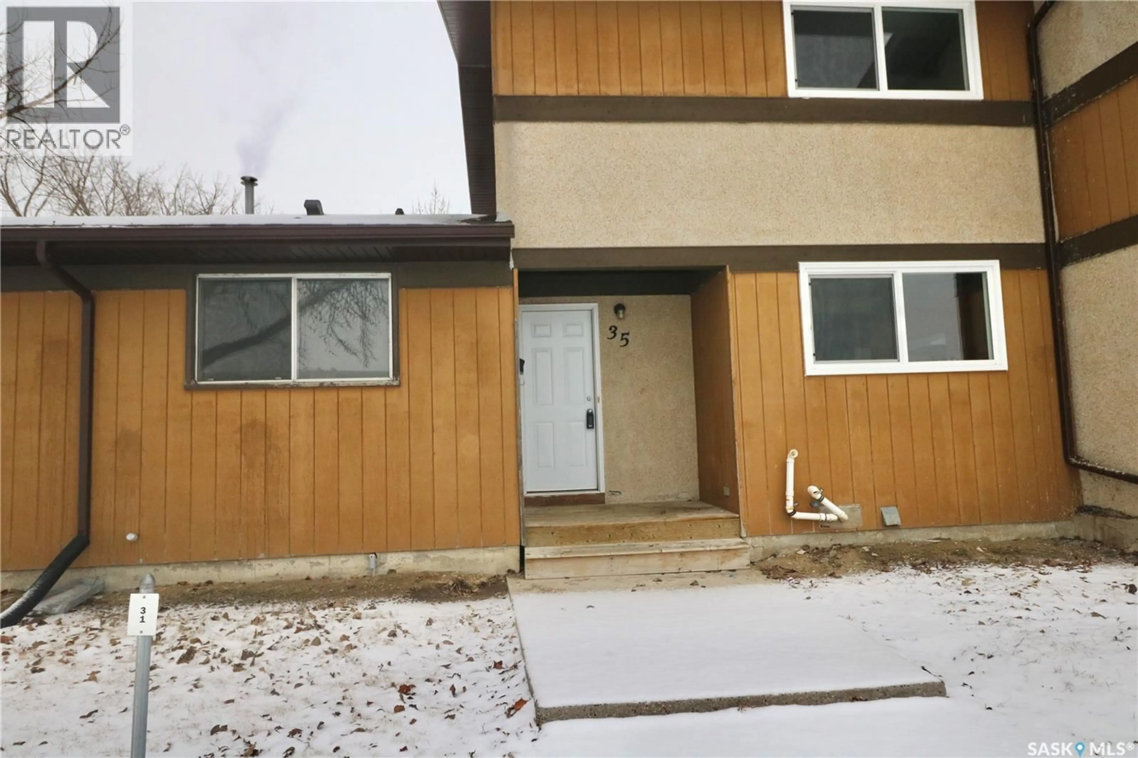 Home with vinyl exterior material, street for 35 MACKENZIE WAY, Regina Saskatchewan S4N5M5
