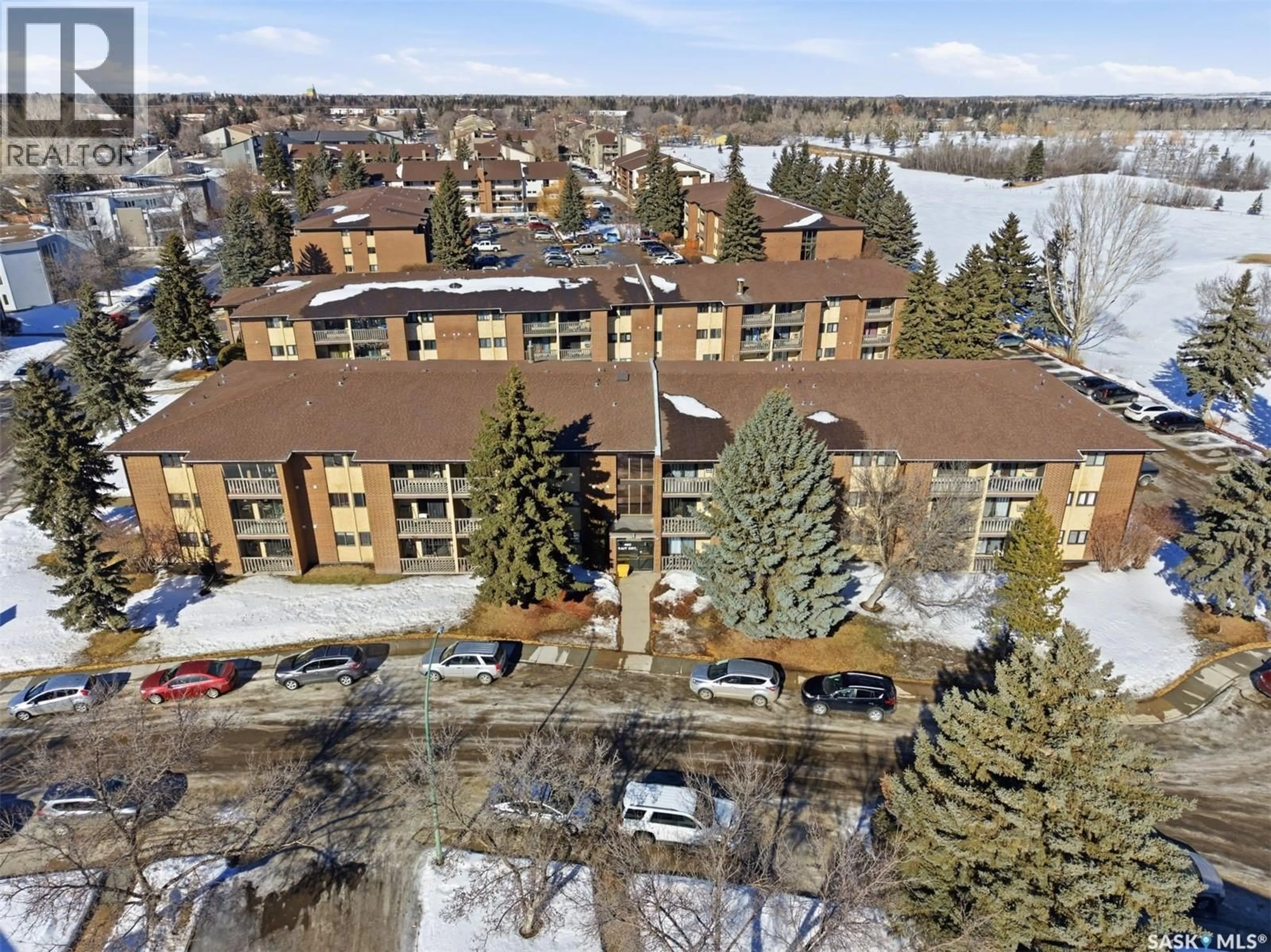 A pic from outside/outdoor area/front of a property/back of a property/a pic from drone, unknown for 403 - 306 TAIT COURT, Saskatoon Saskatchewan S7H5L3
