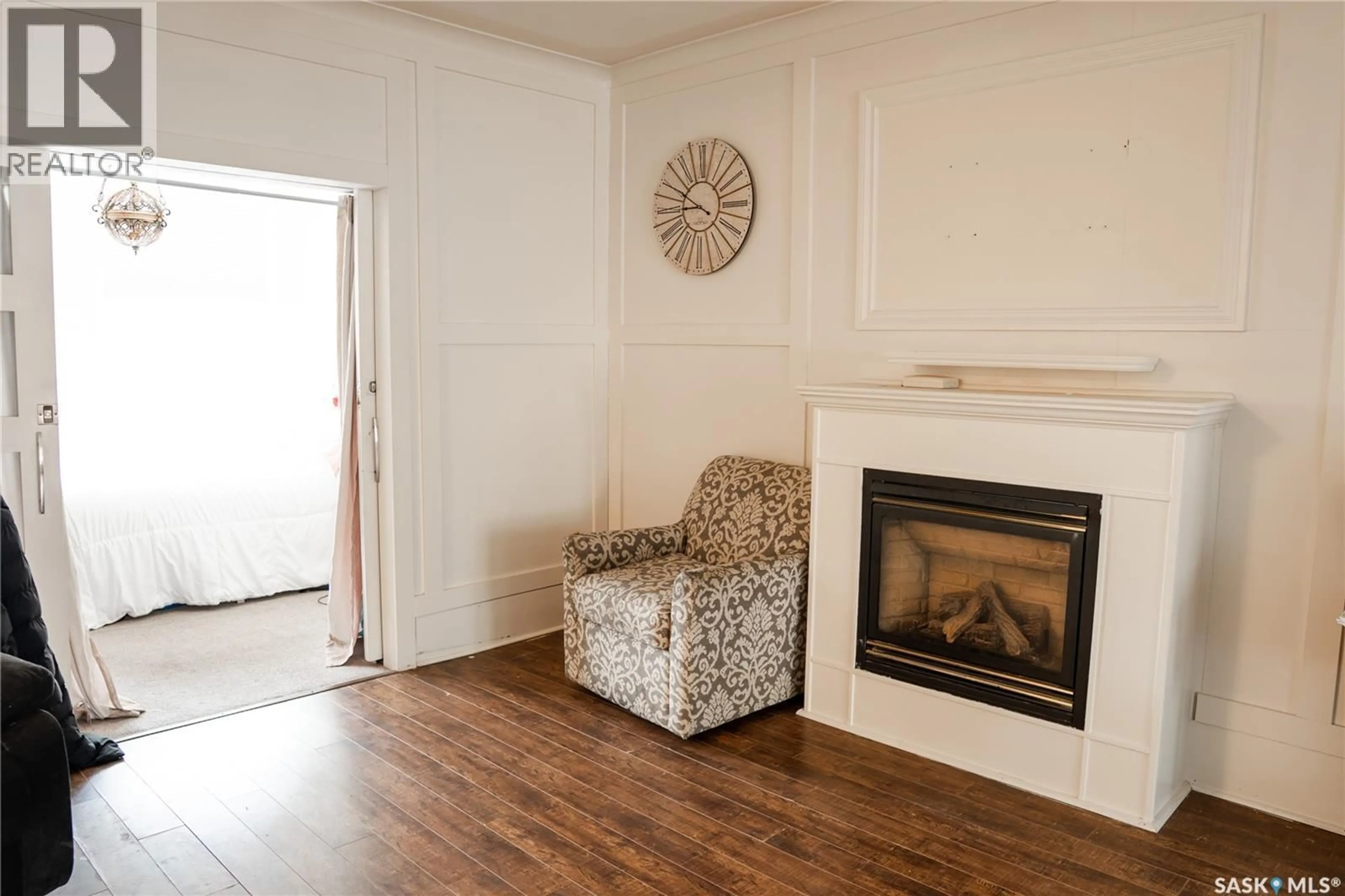 Living room with furniture, wood/laminate floor for 2128 OSLER STREET, Regina Saskatchewan S4P1W6