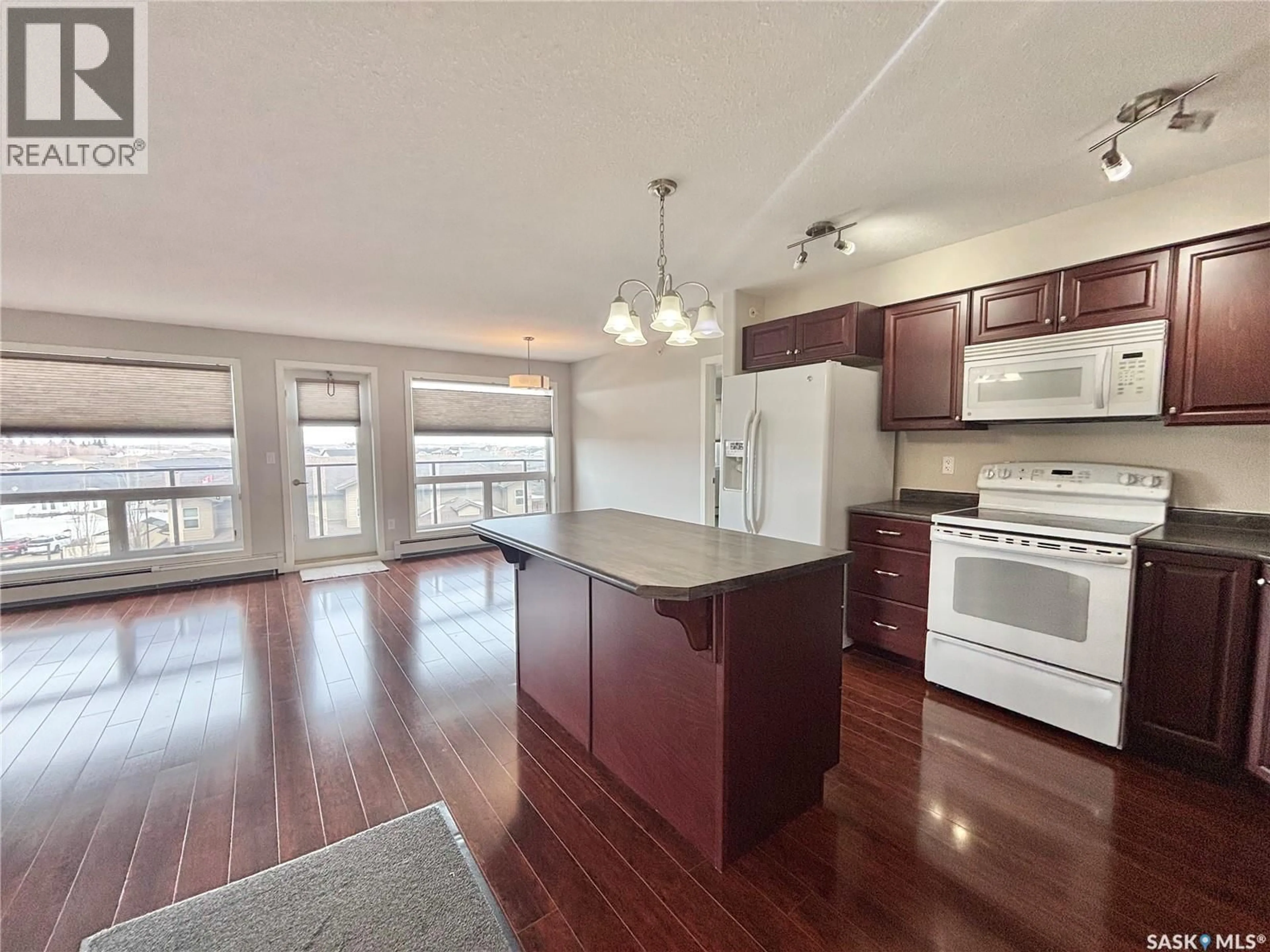 Open concept kitchen, wood/laminate floor for 333 - 302 MORRISON DRIVE, Yorkton Saskatchewan S3N3R7