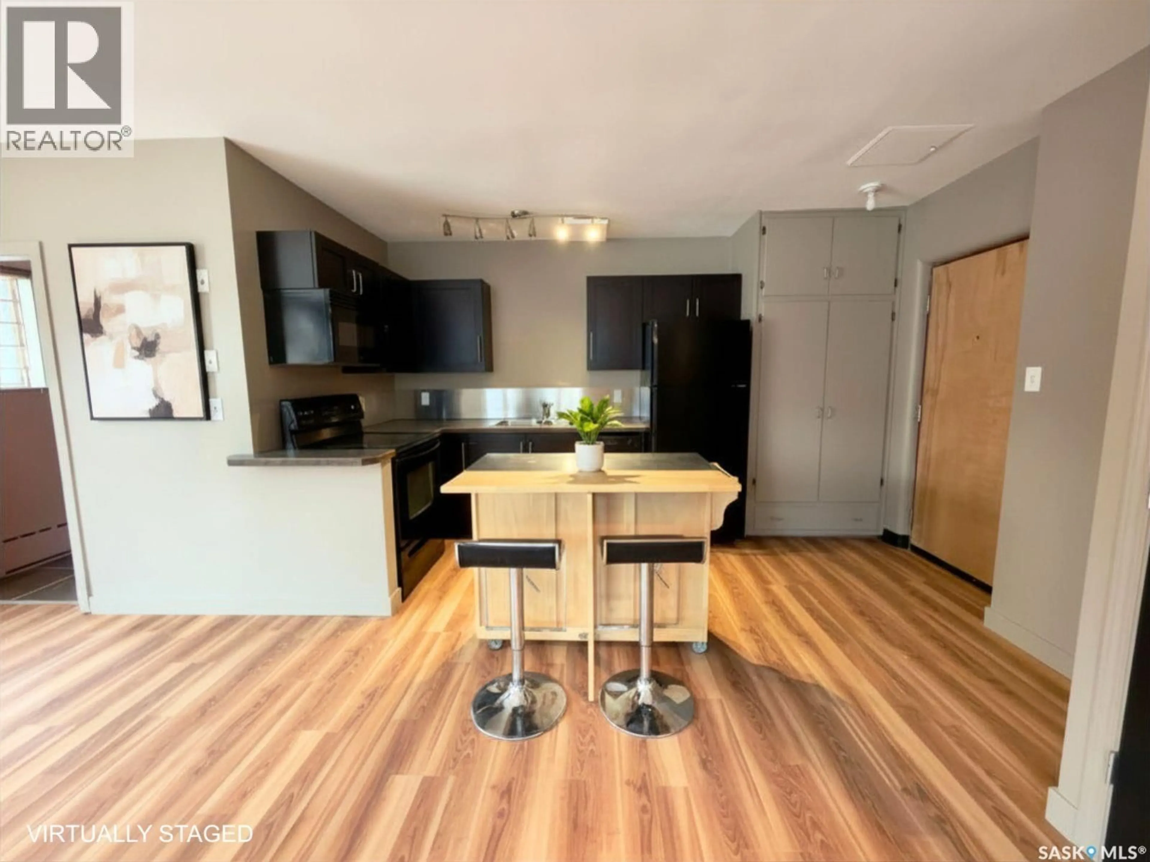 Open concept kitchen, wood/laminate floor for 2400 4TH AVENUE, Saskatoon Saskatchewan S7K0R3