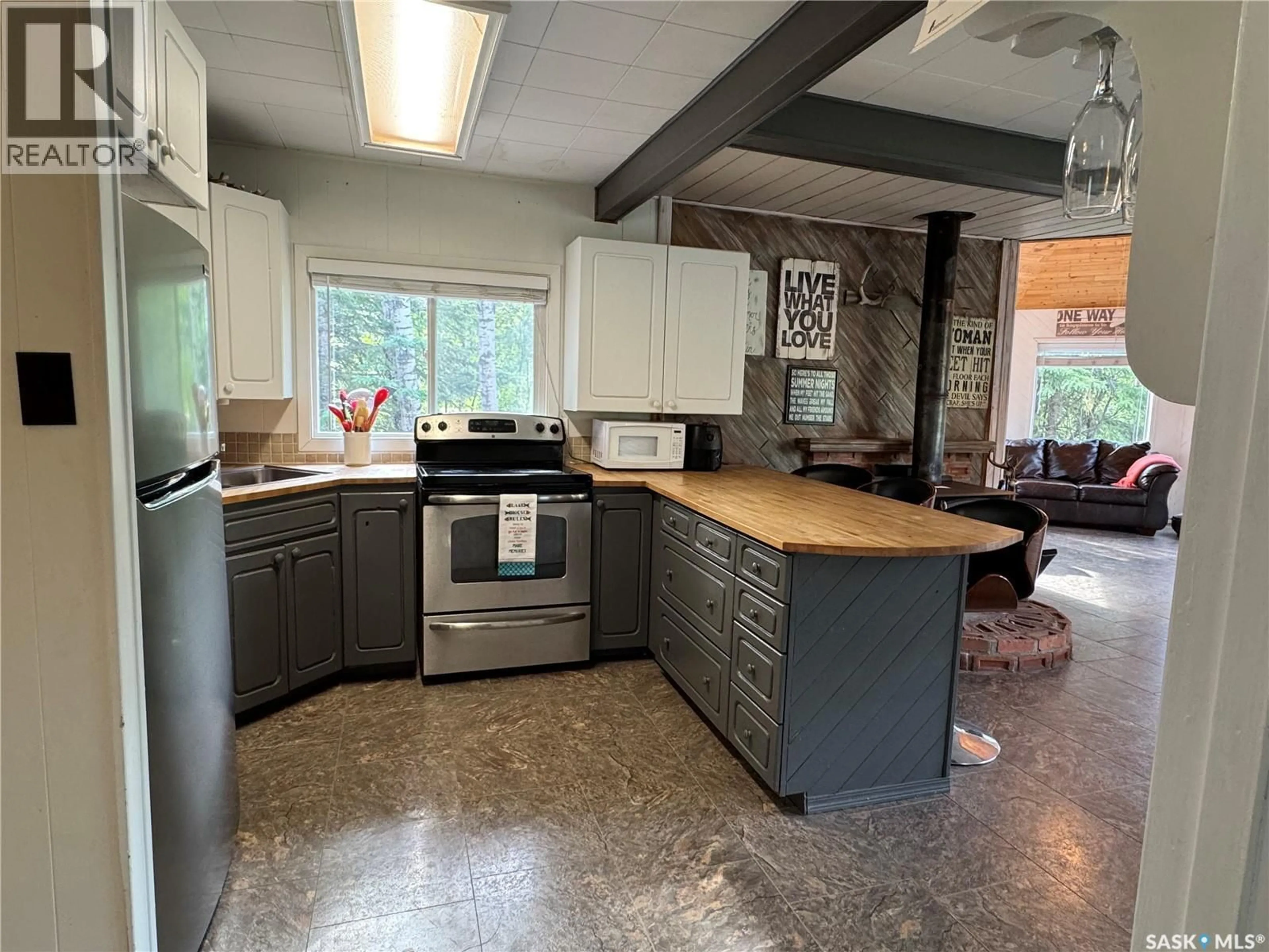 Open concept kitchen, ceramic/tile floor for 102 DORAN AVENUE, Christopher Lake Saskatchewan S0J0N0