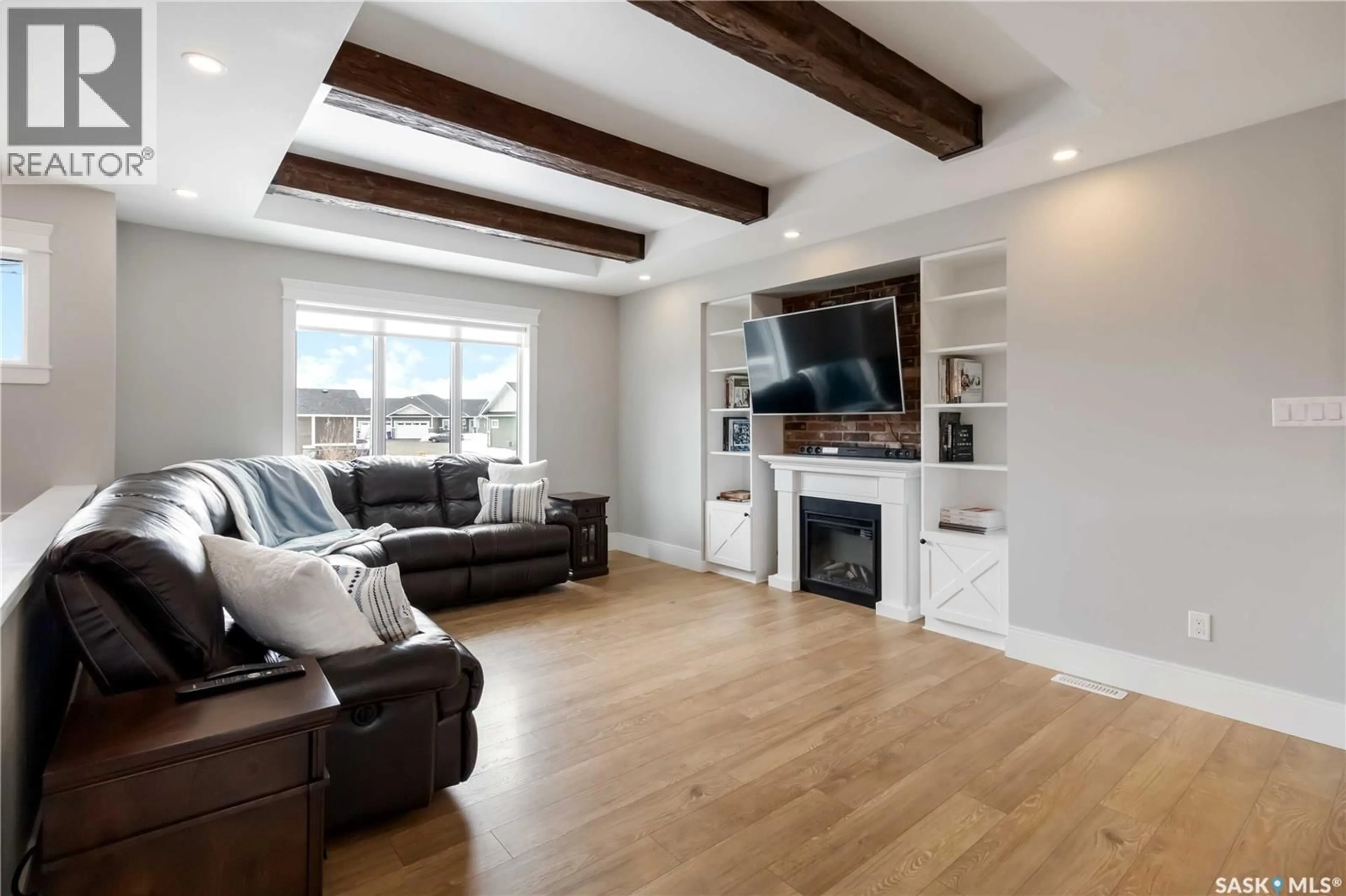 Living room with furniture, wood/laminate floor for 436 PALMER CRESCENT, Warman Saskatchewan S0K4S1