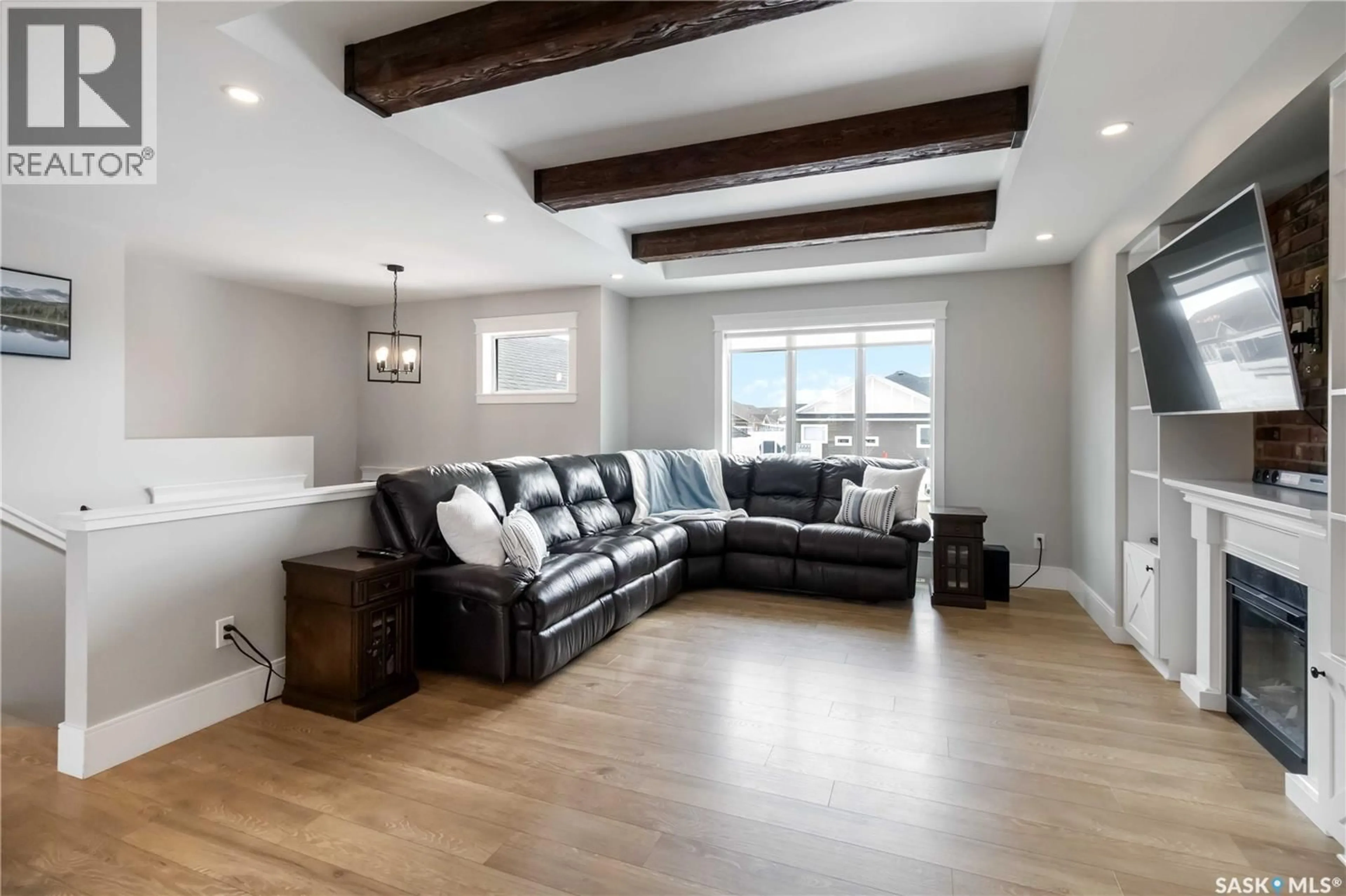 Living room with furniture, wood/laminate floor for 436 PALMER CRESCENT, Warman Saskatchewan S0K4S1