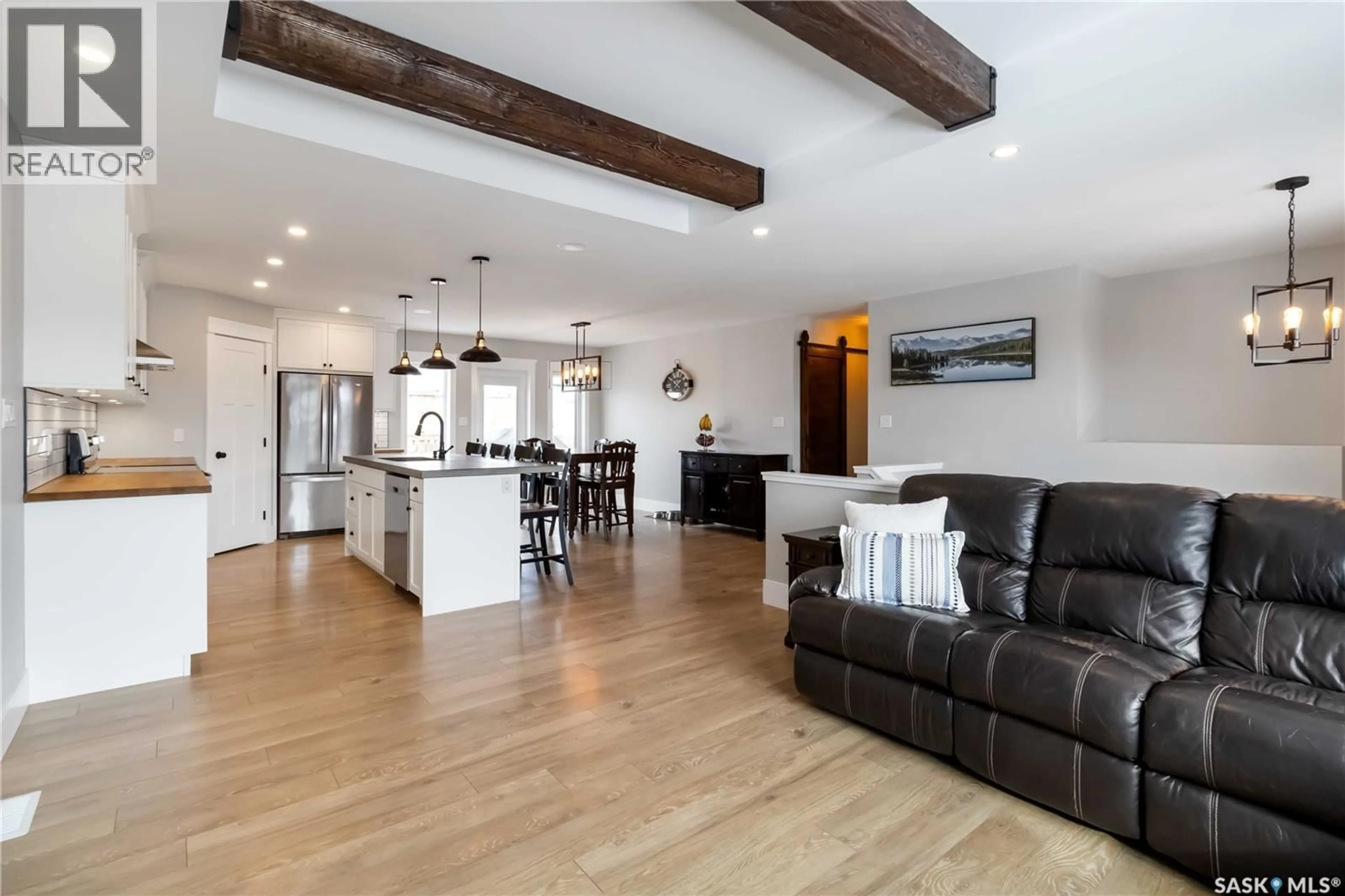 Open concept kitchen, wood/laminate floor for 436 PALMER CRESCENT, Warman Saskatchewan S0K4S1