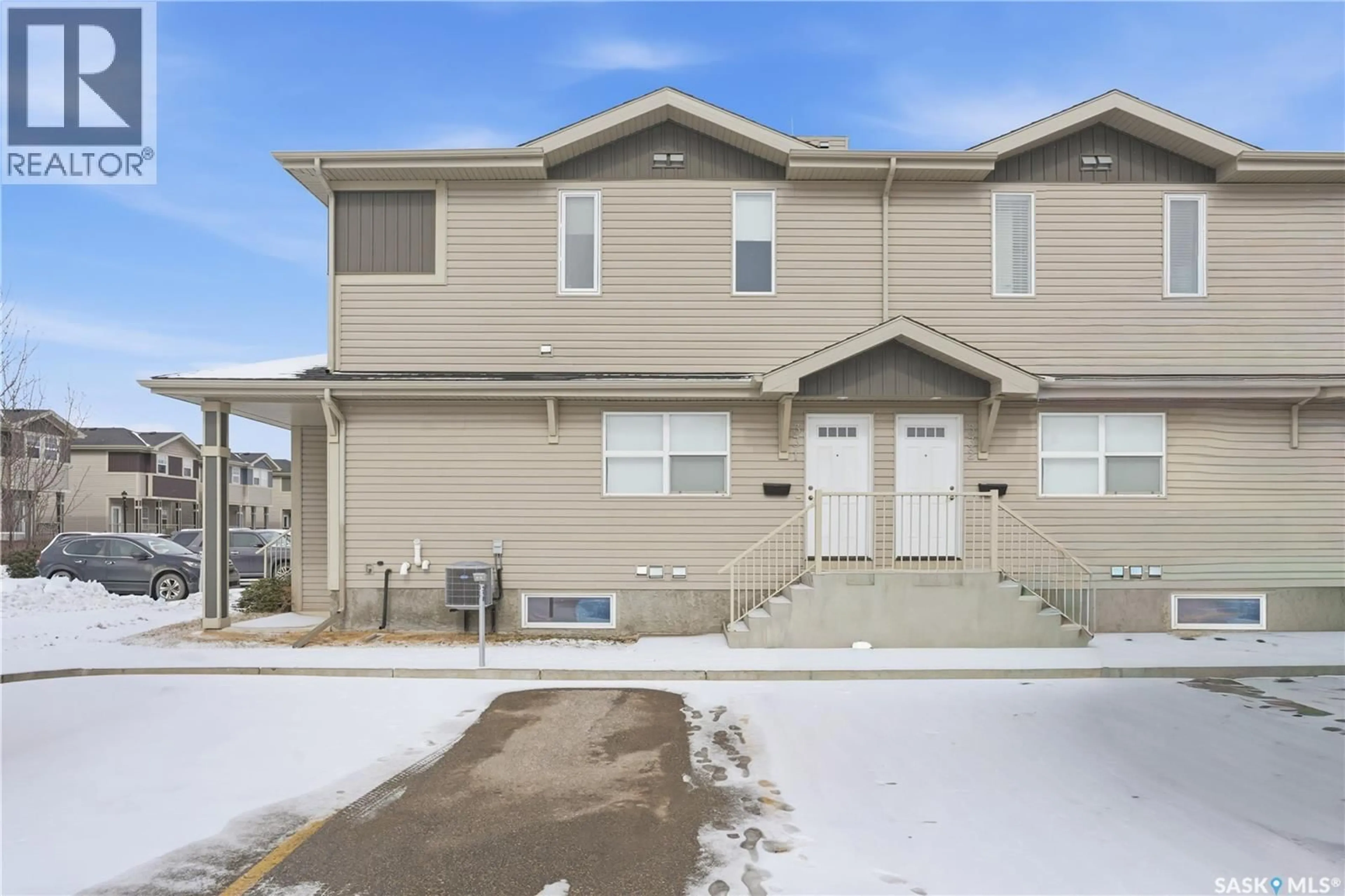 Home with vinyl exterior material, street for 100 - 331 CHAPARRAL BOULEVARD, Martensville Saskatchewan S0K0A2