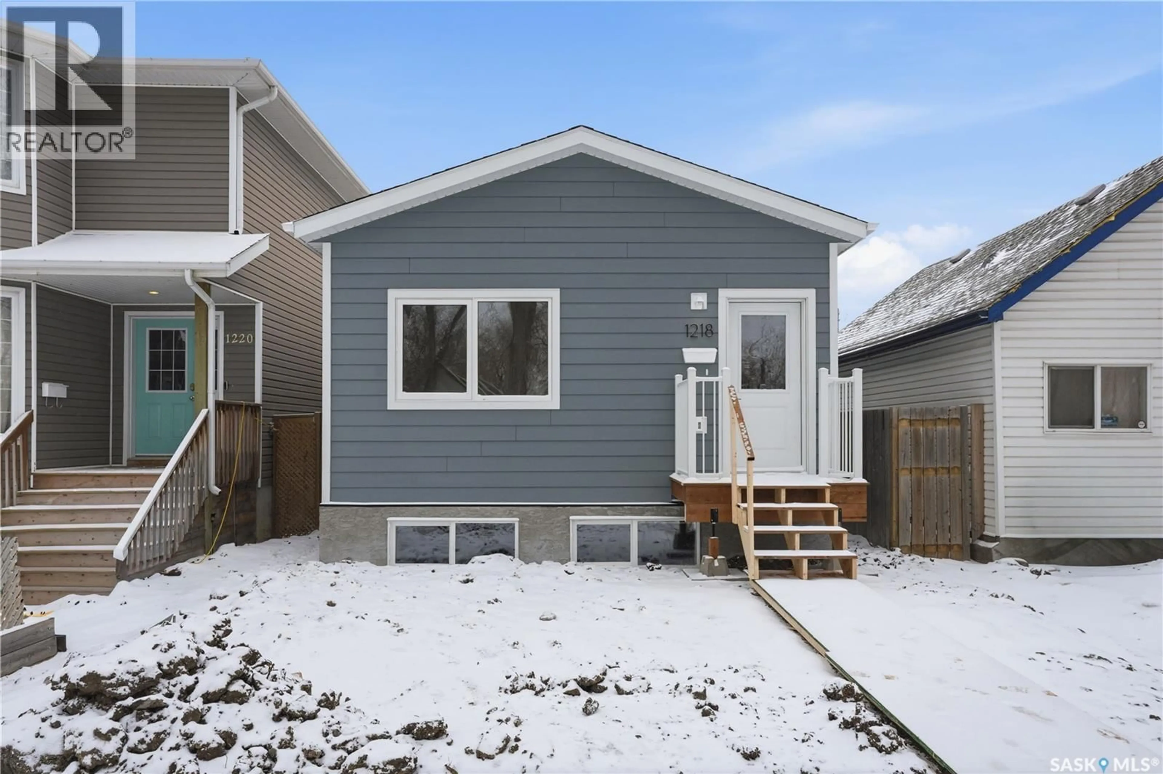 Home with vinyl exterior material, street for 1218 G AVENUE, Saskatoon Saskatchewan S7L2A4