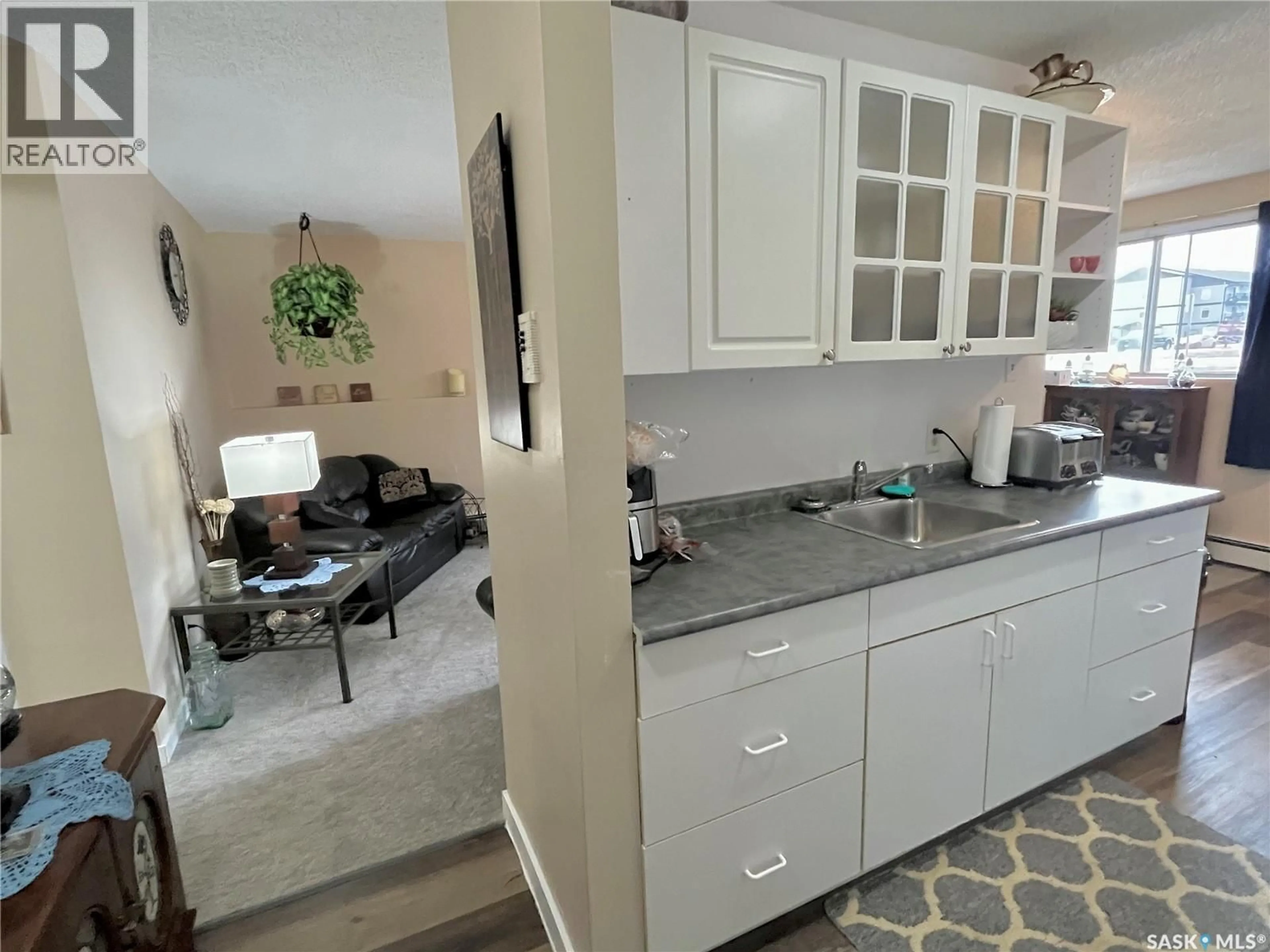 Open concept kitchen, ceramic/tile floor for 101 - 502 5TH AVENUE, Weyburn Saskatchewan S4H2W1