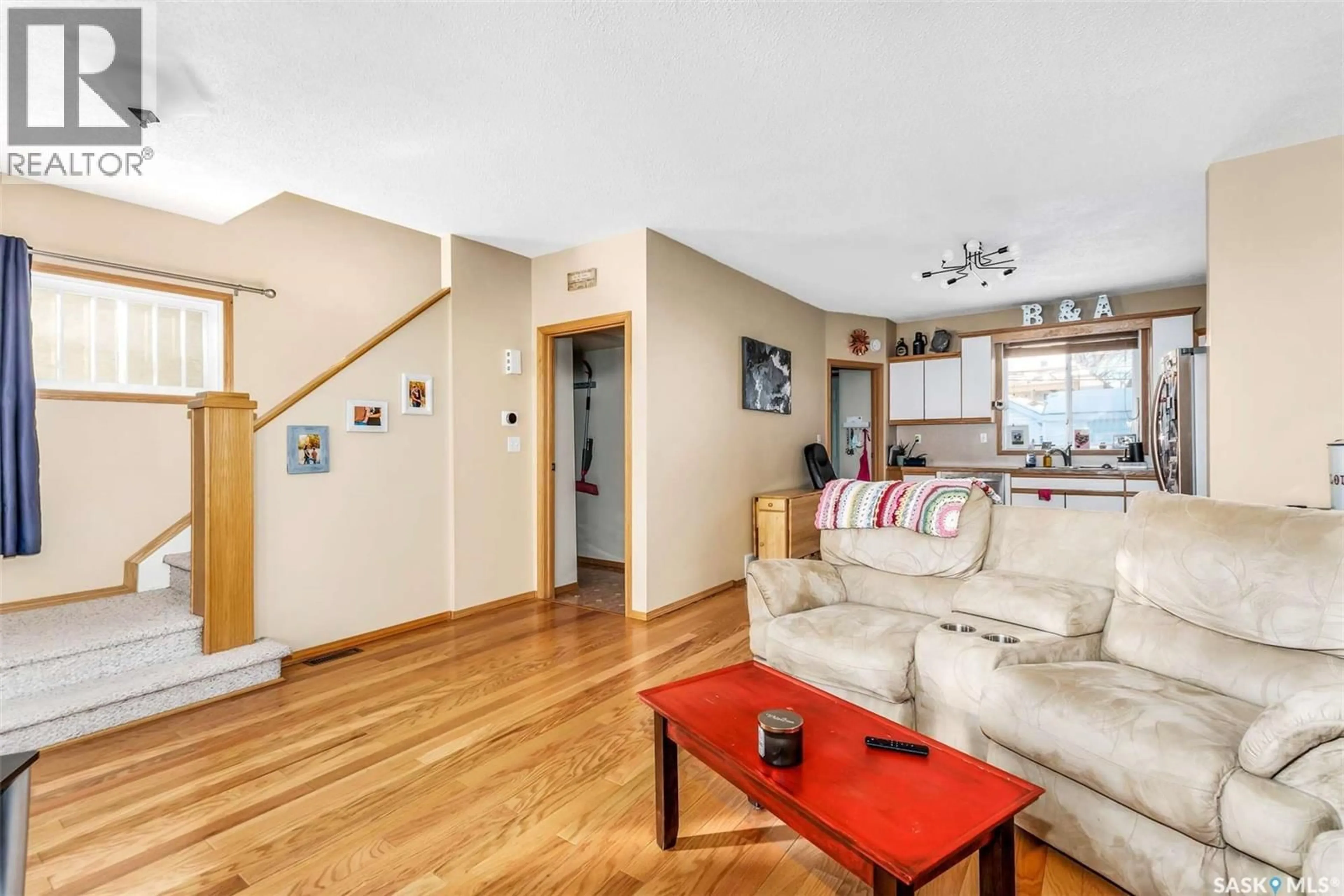 Living room with furniture, wood/laminate floor for 2244 HALIFAX STREET, Regina Saskatchewan S4P1V2