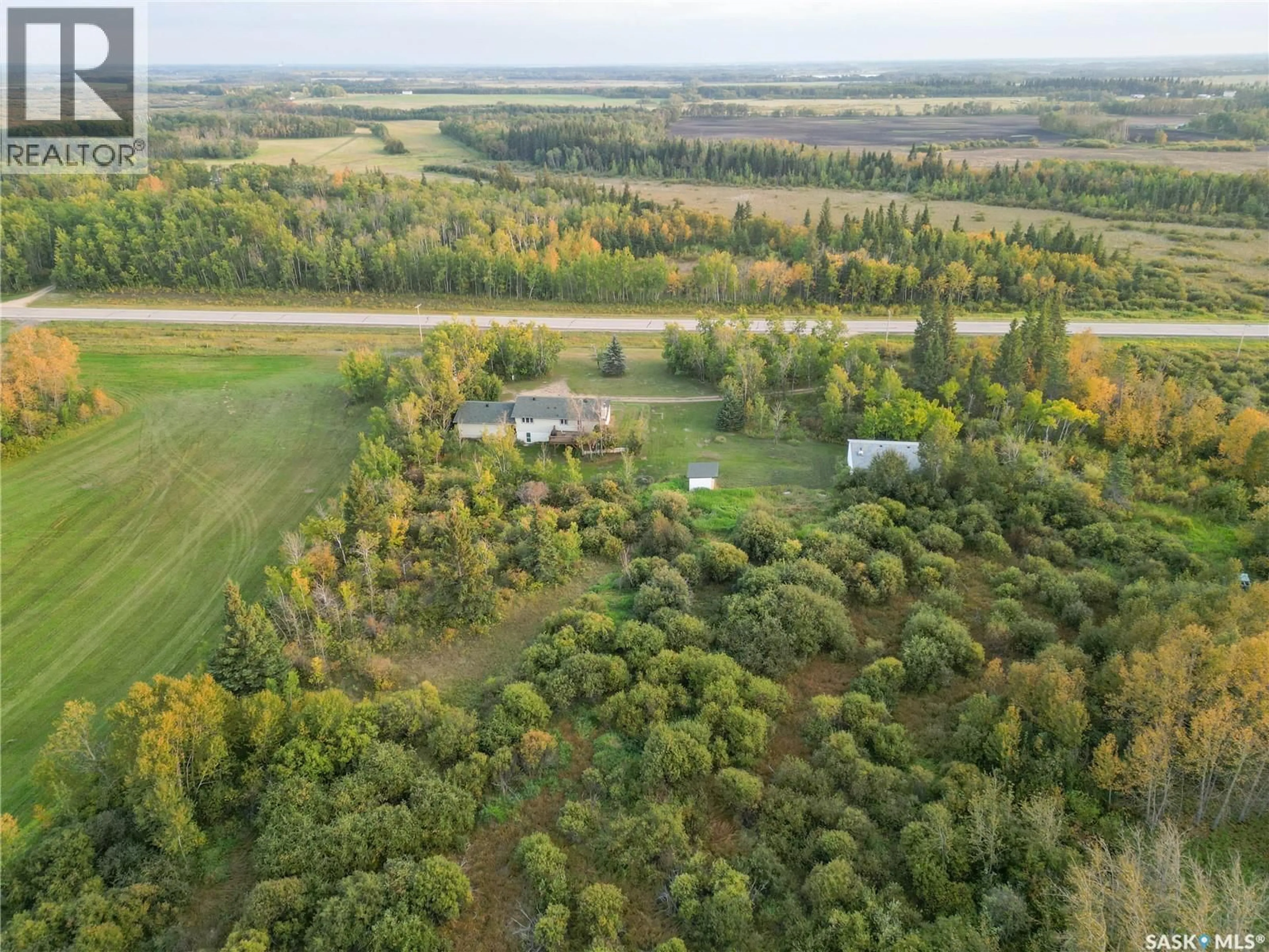 A pic from outside/outdoor area/front of a property/back of a property/a pic from drone, forest/trees view for SPRUCE HOME ACREAGE, Buckland Rm No. 491 Saskatchewan S0J2N0