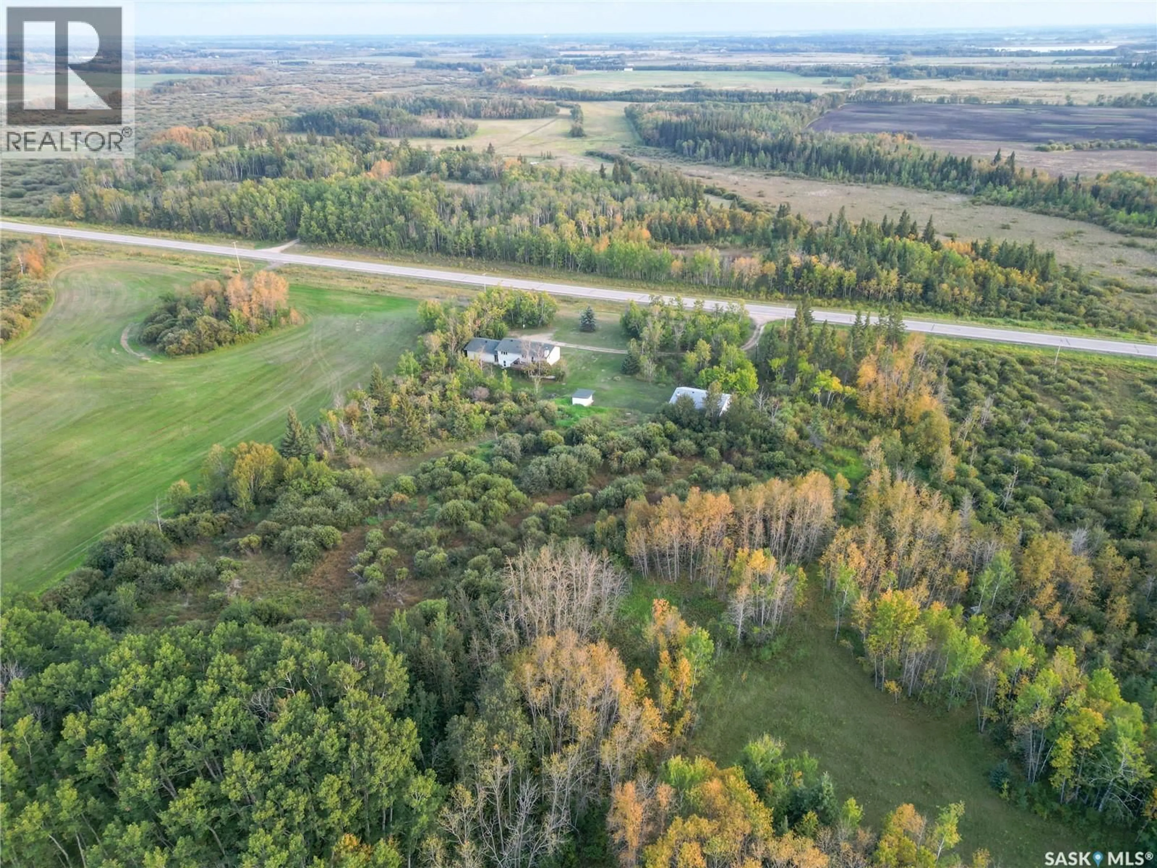 A pic from outside/outdoor area/front of a property/back of a property/a pic from drone, forest/trees view for SPRUCE HOME ACREAGE, Buckland Rm No. 491 Saskatchewan S0J2N0