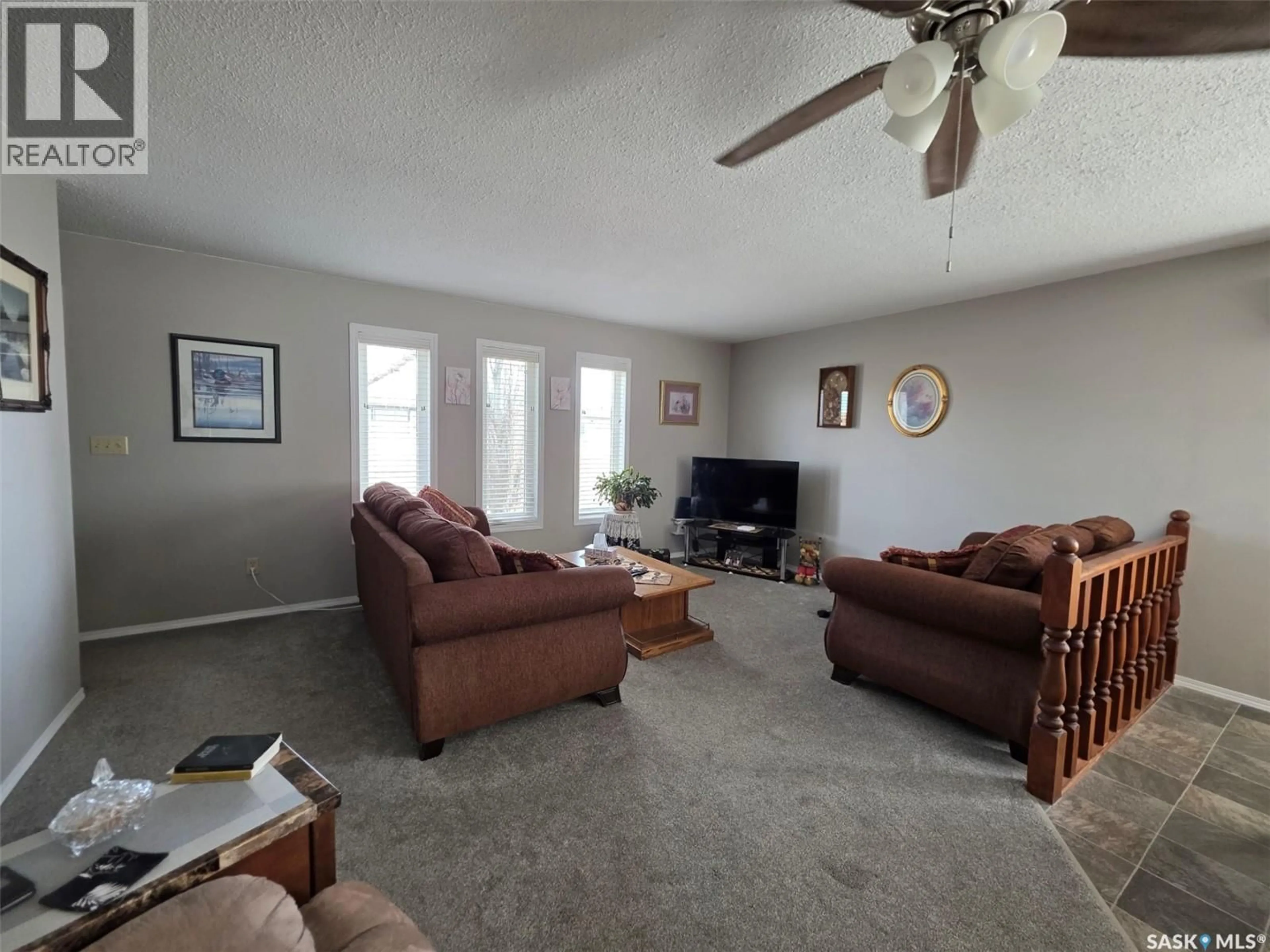 Living room with furniture, unknown for 113 3RD STREET, Mankota Saskatchewan S0H2W0