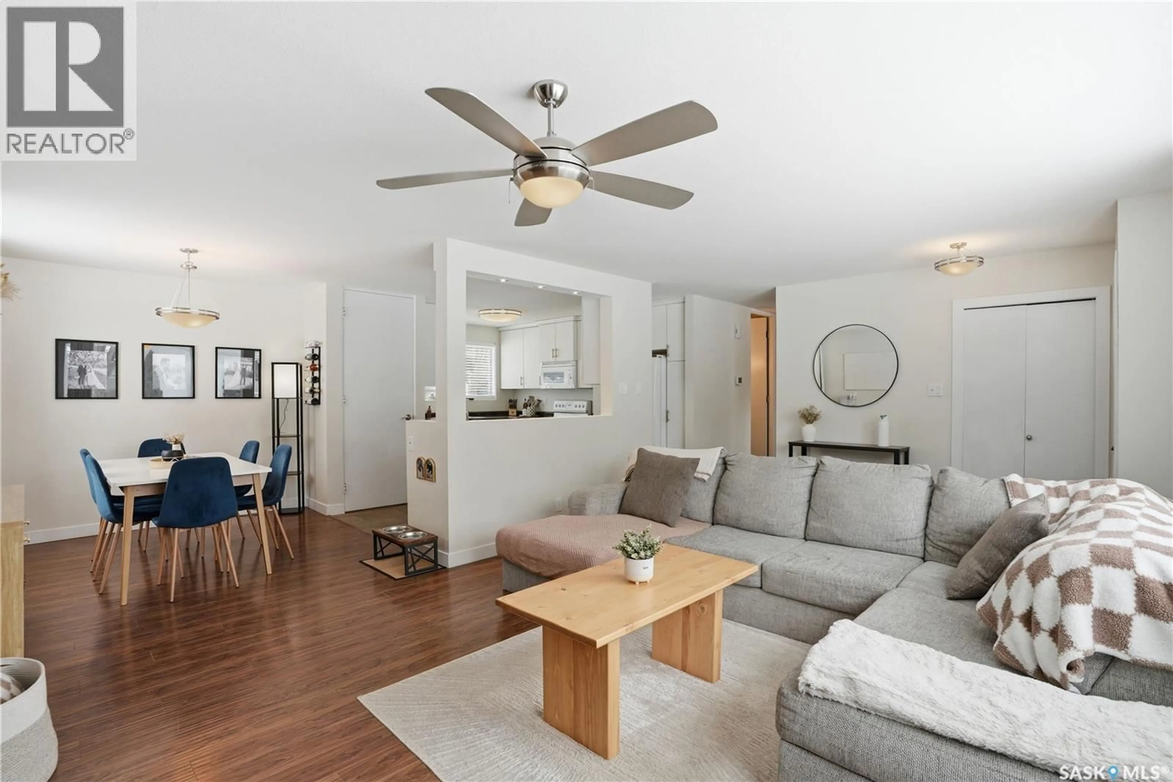 Living room with furniture, wood/laminate floor for 11 LING STREET, Saskatoon Saskatchewan S7H3G4