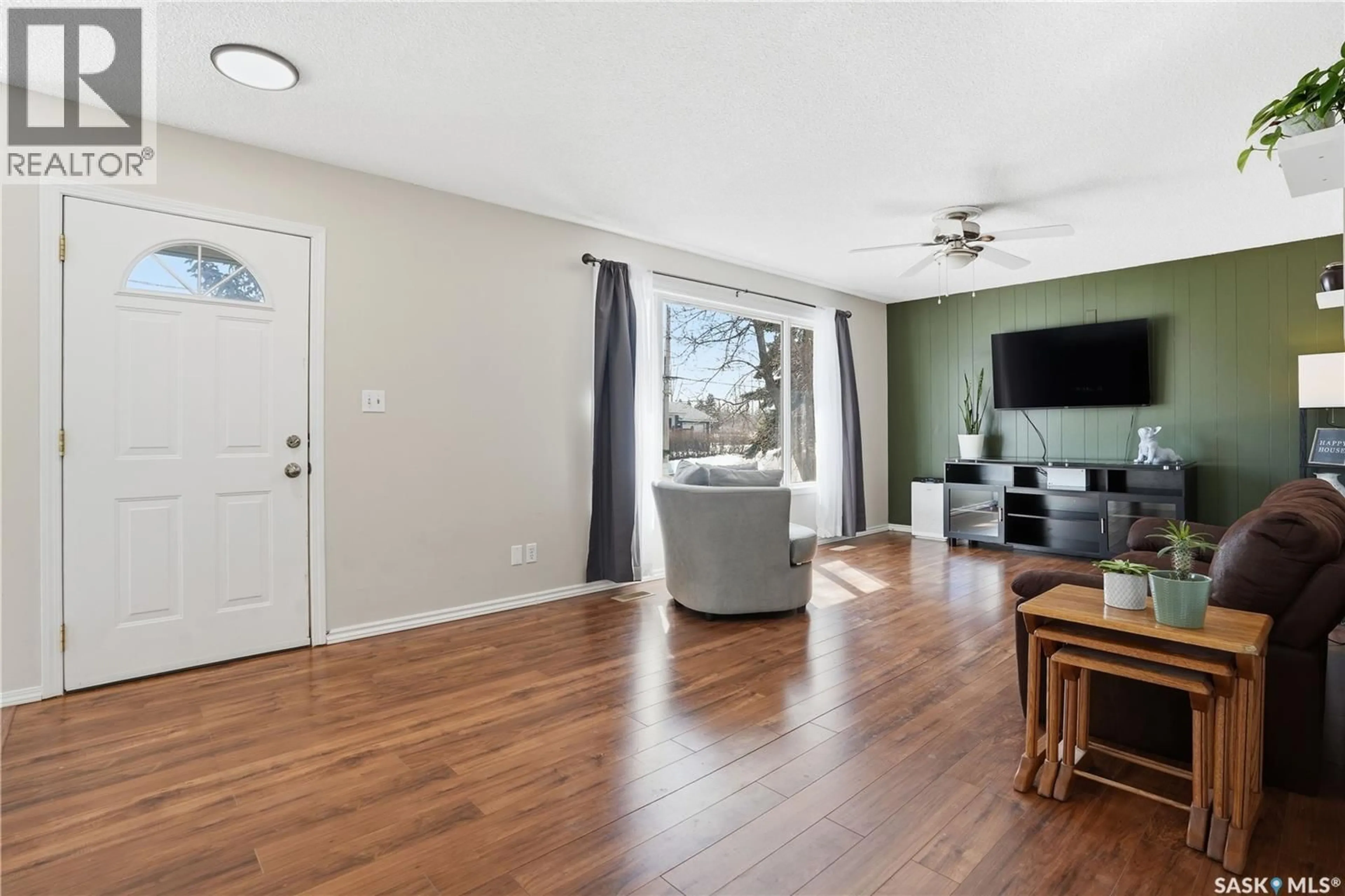 Living room with furniture, wood/laminate floor for 1005 WATER STREET, Indian Head Saskatchewan S0G2K0