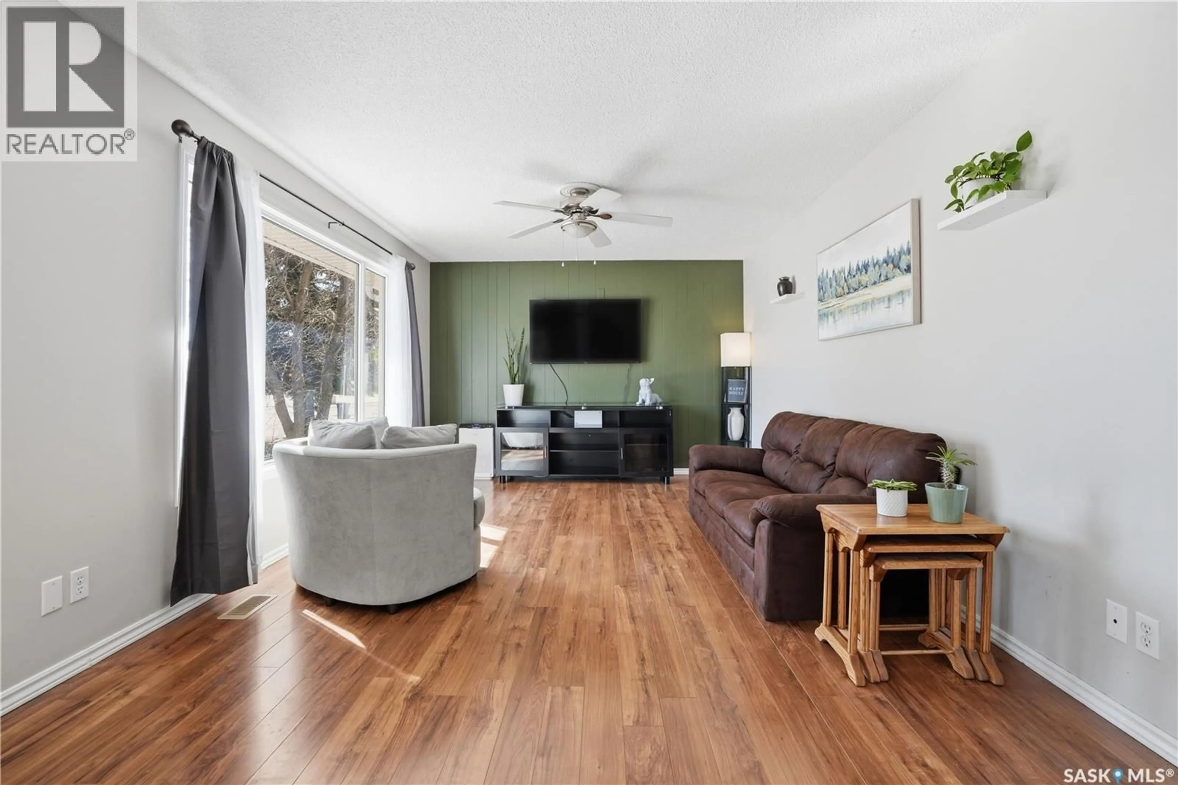Living room with furniture, wood/laminate floor for 1005 WATER STREET, Indian Head Saskatchewan S0G2K0