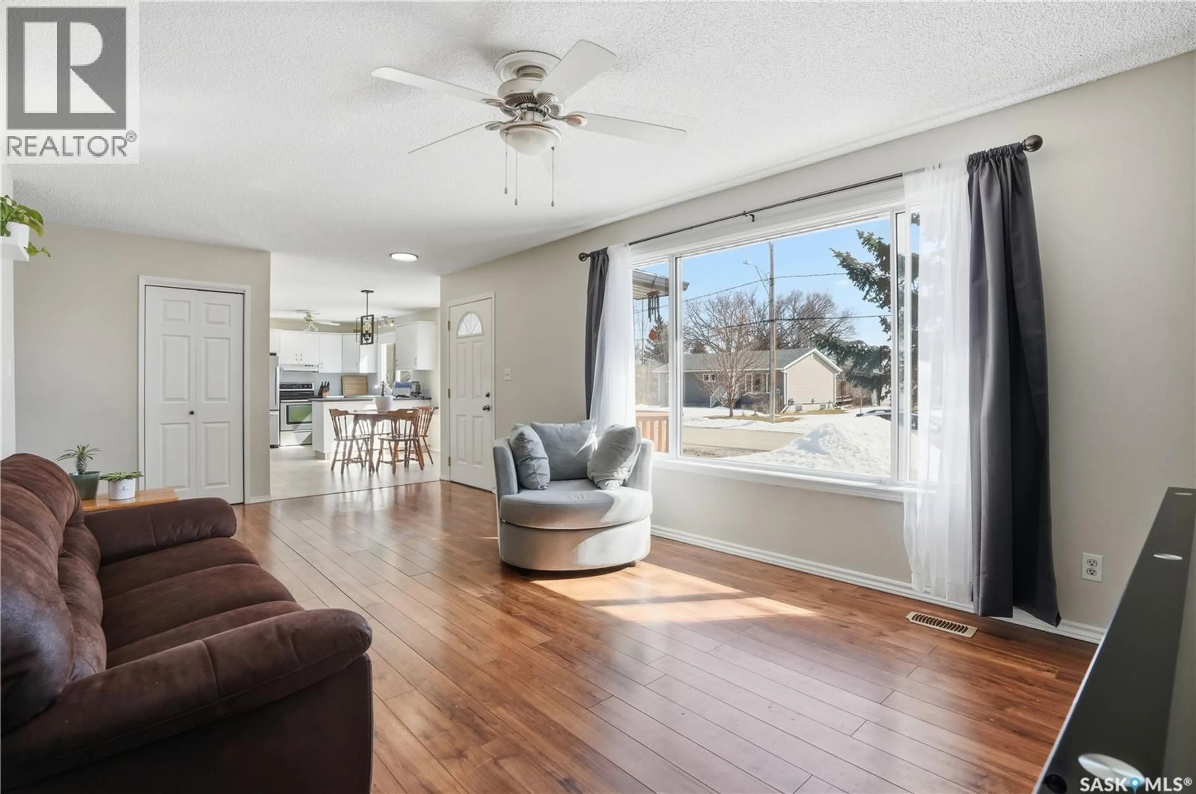 Living room with furniture, wood/laminate floor for 1005 WATER STREET, Indian Head Saskatchewan S0G2K0