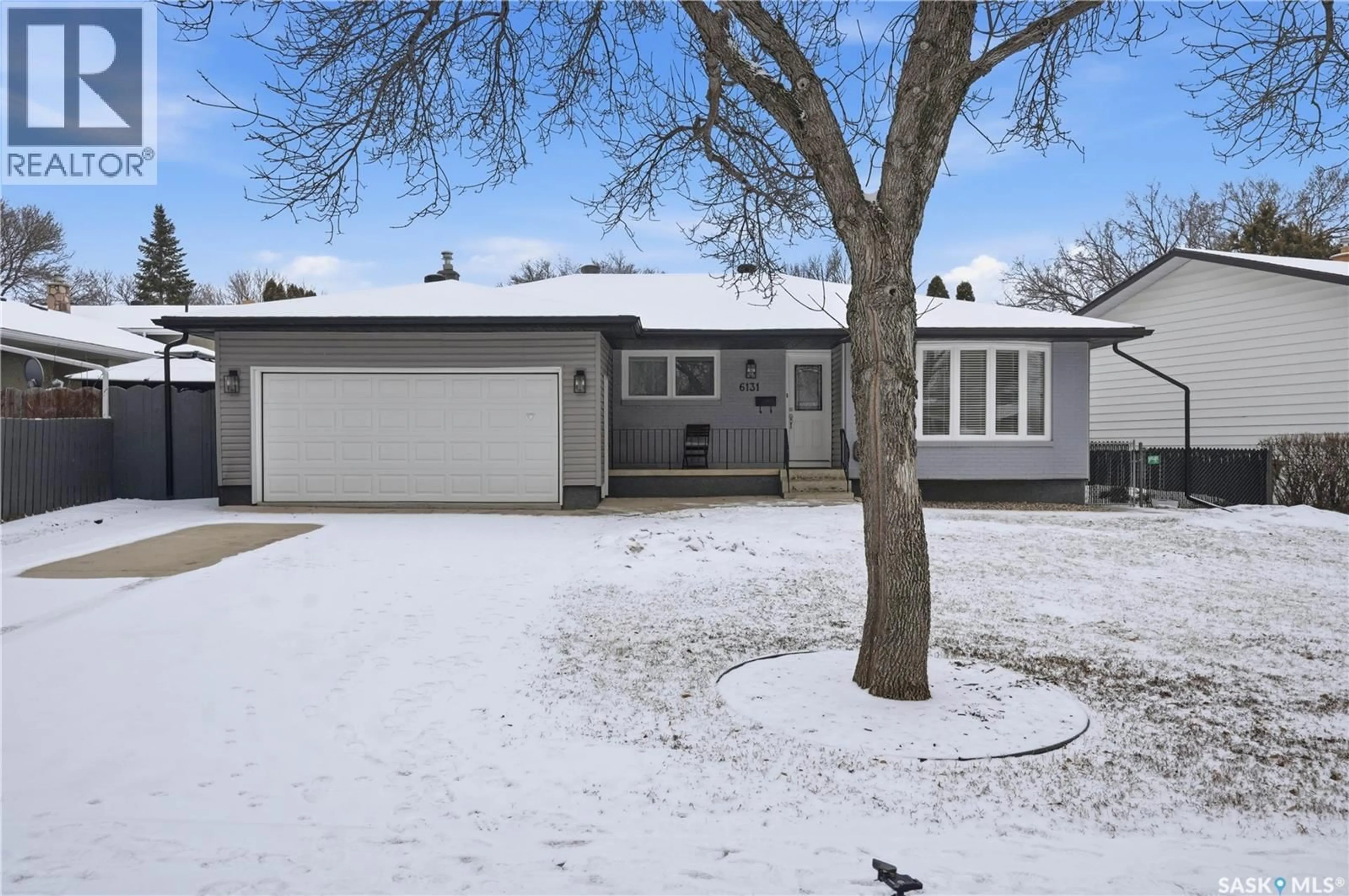 Home with vinyl exterior material, street for 6131 7TH AVENUE, Regina Saskatchewan S4T6Y9