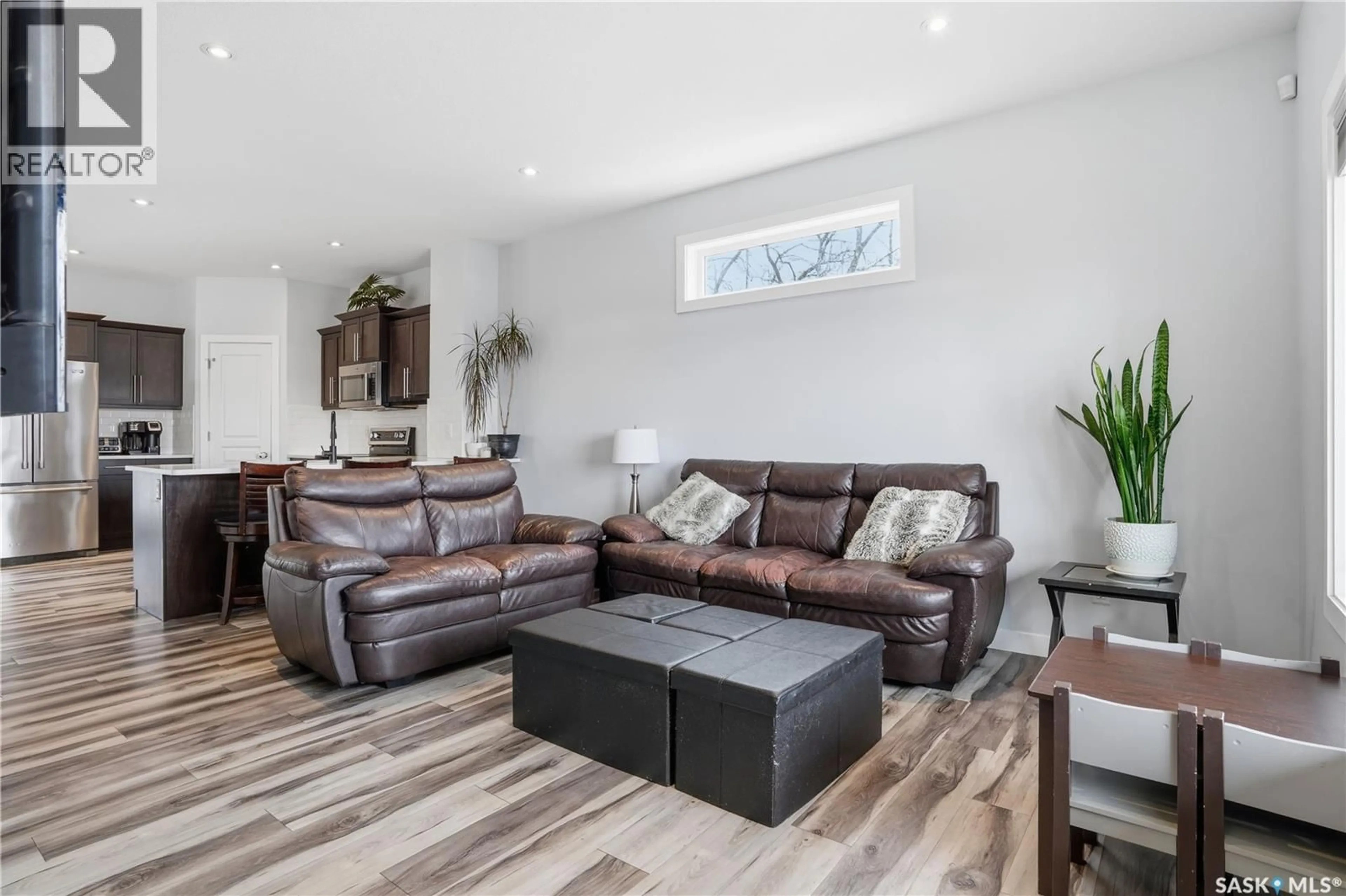 Living room with furniture, wood/laminate floor for 806 GROVE AVENUE, Saskatchewan Beach Saskatchewan S0G4L0